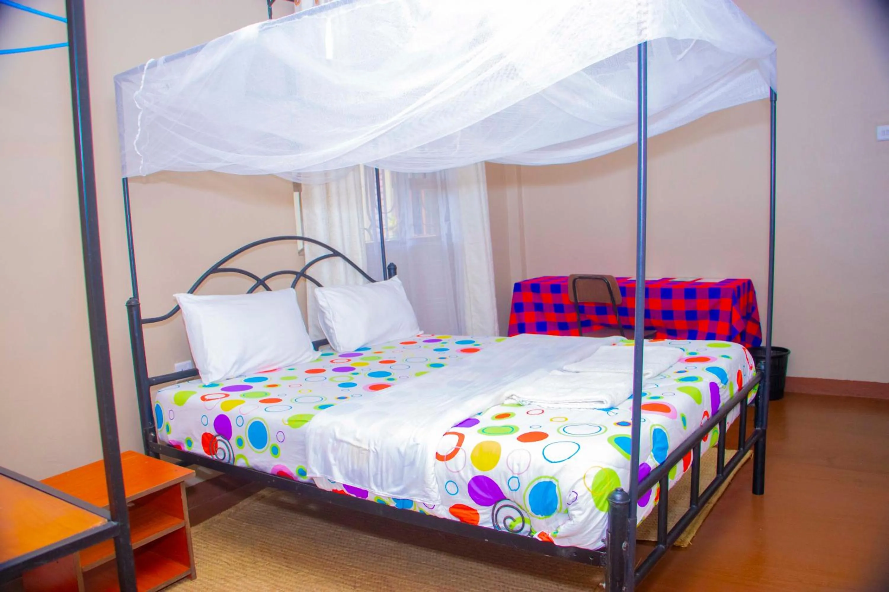 Bed in Endasawa Tree Lodge