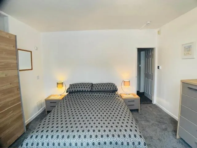 Bed in Bedford Holiday Apartments