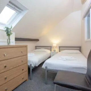 Bed in Bedford Holiday Apartments