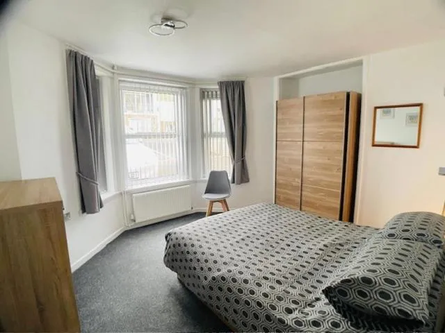 Bed in Bedford Holiday Apartments