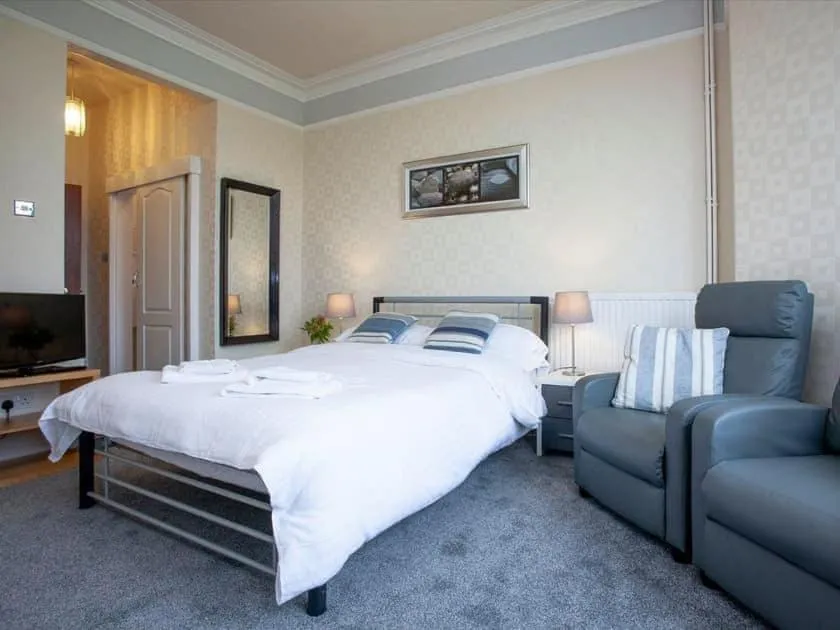 Bed in Bedford Holiday Apartments