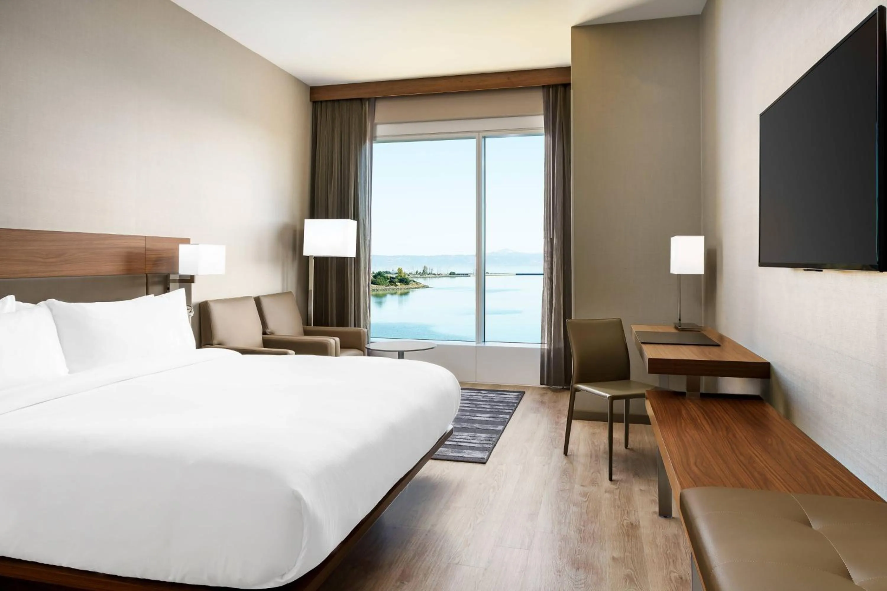 Photo of the whole room, Bed in AC Hotel by Marriott San Francisco Airport/Oyster Point Waterfront