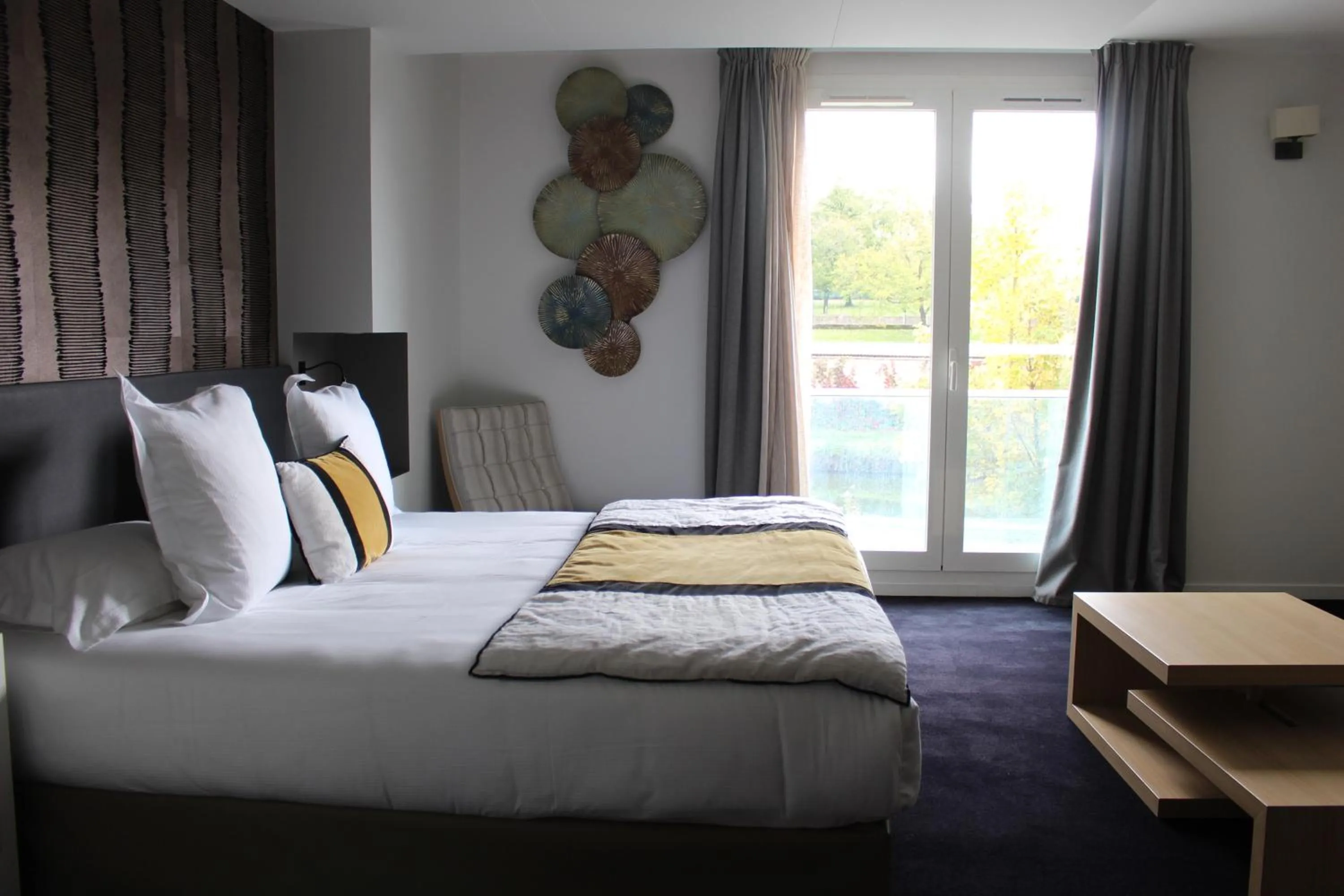 Bed in Le Konine - Hotel & Bar & Restaurant