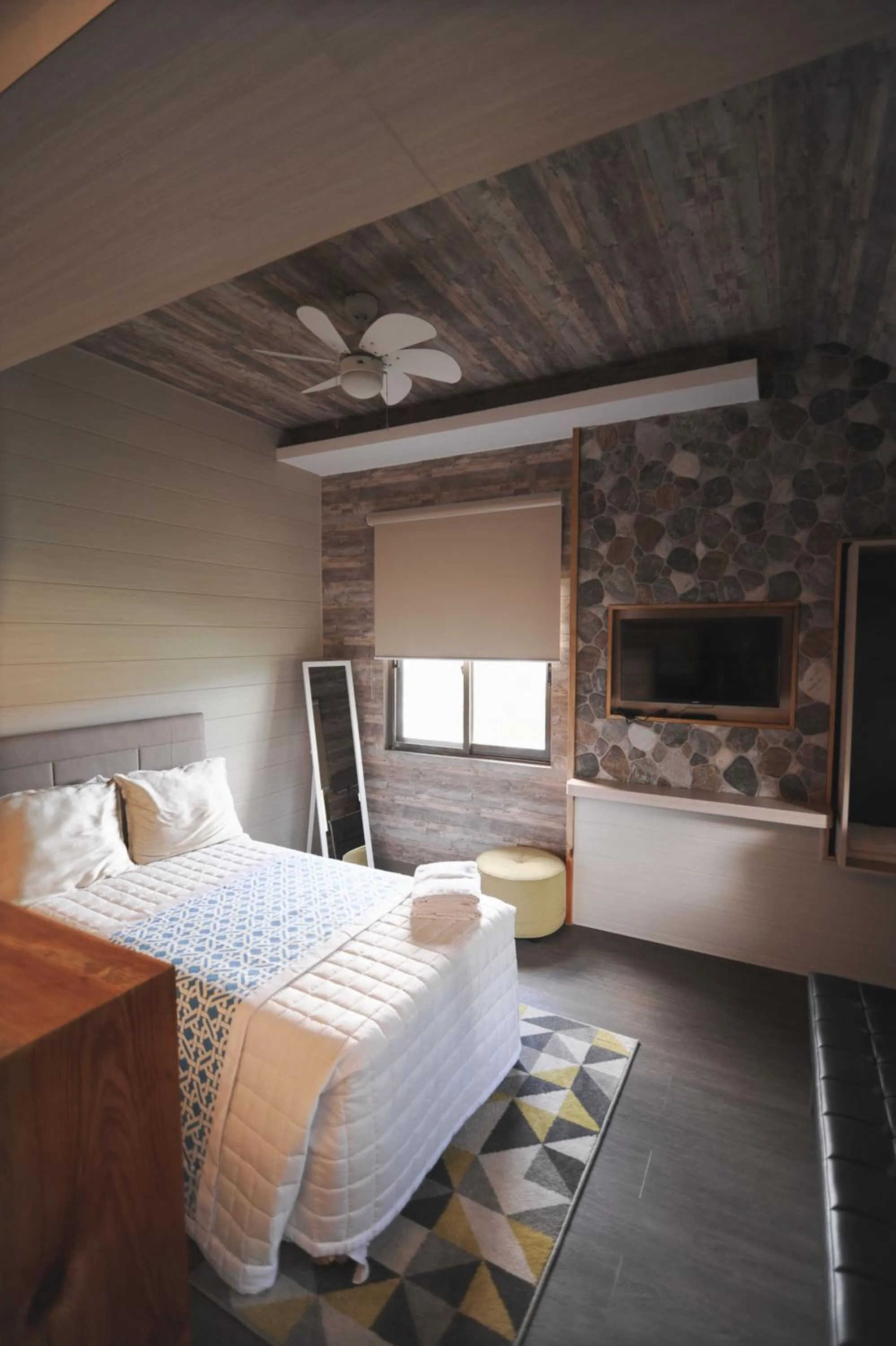 Bed in Pine Breeze Cottages