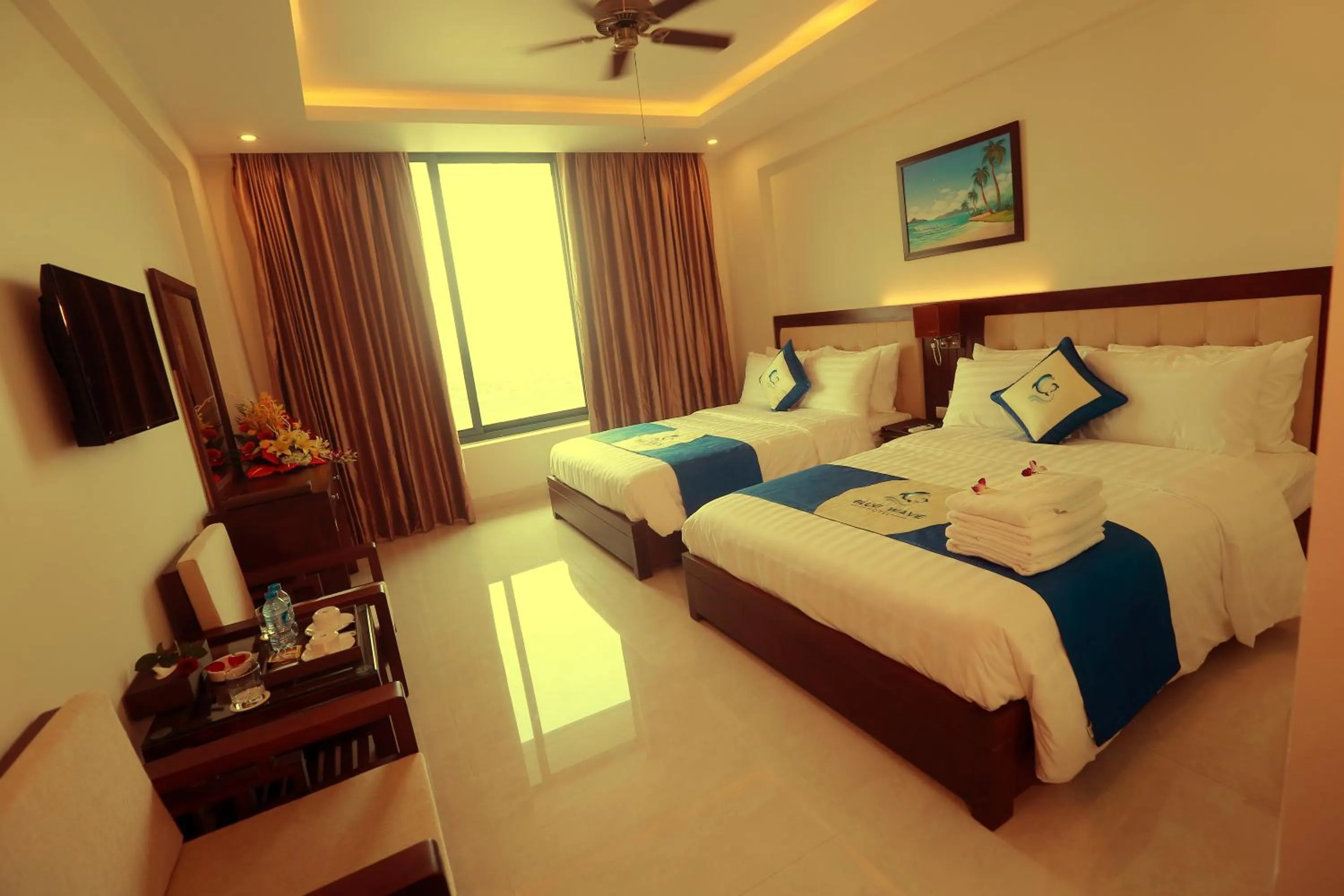 Bed in Blue Wave Hotel