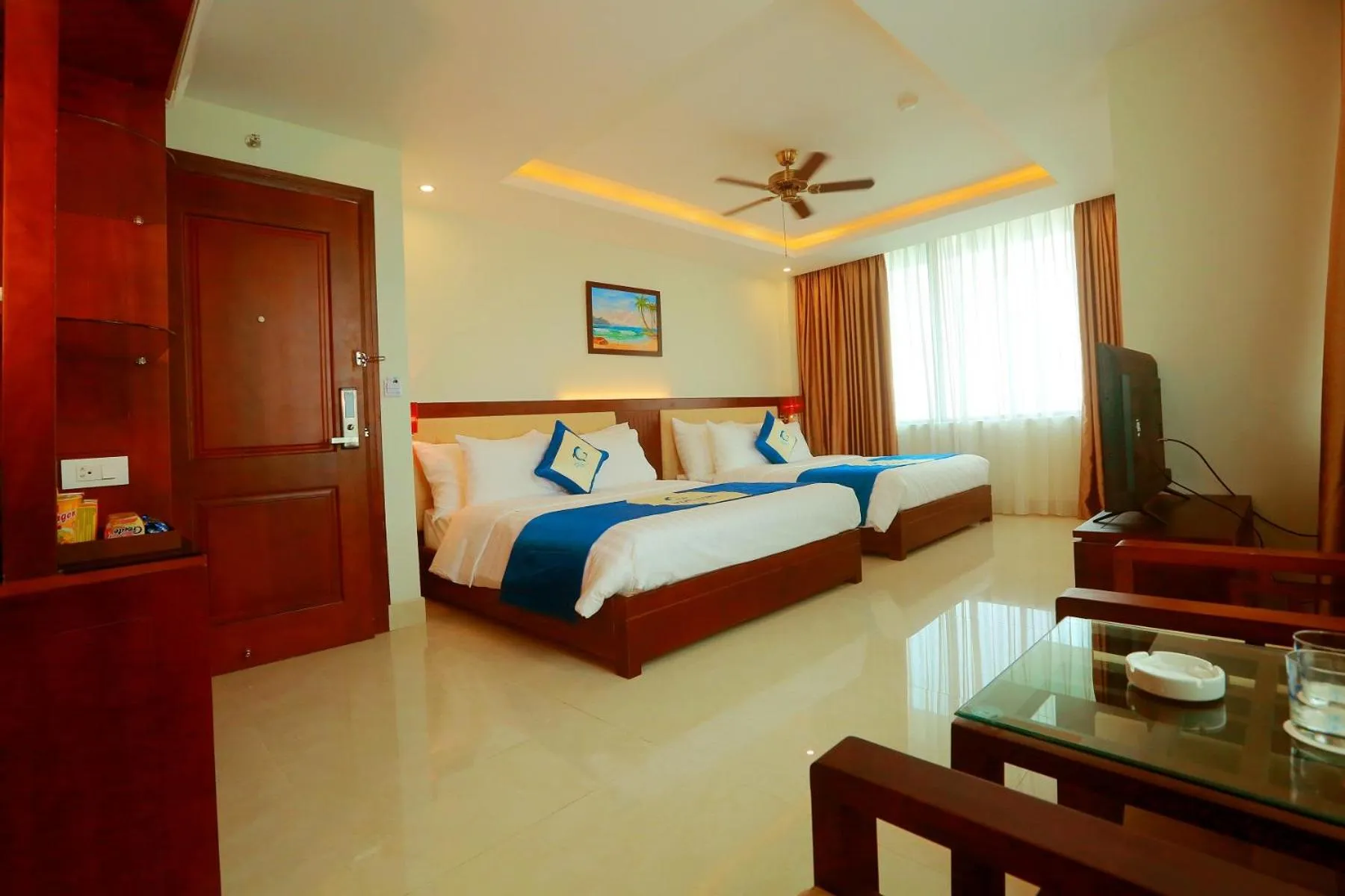 Bed in Blue Wave Hotel