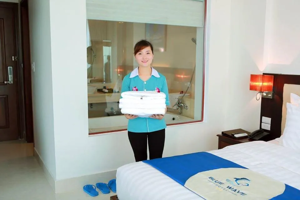 Bed in Blue Wave Hotel