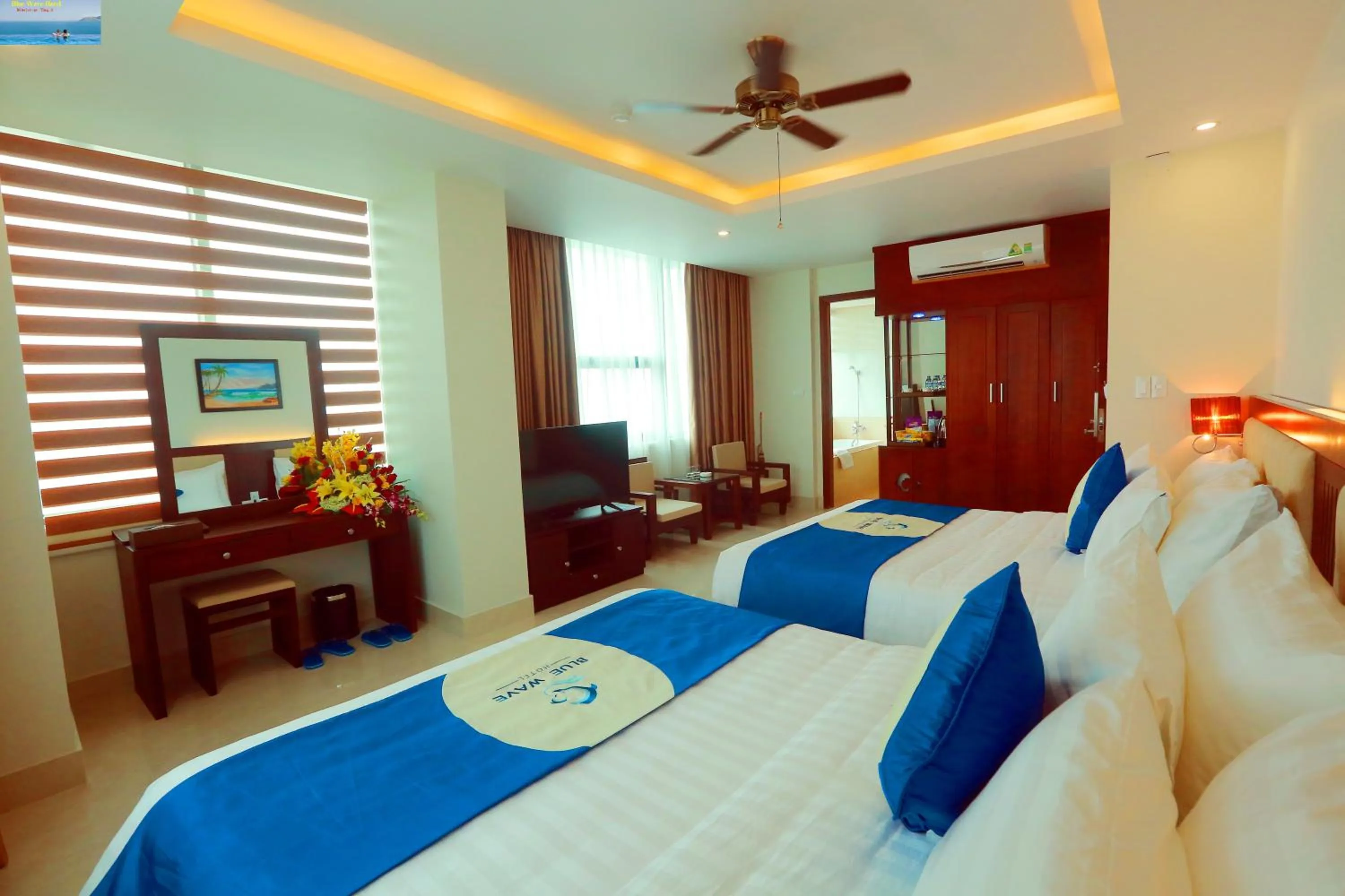 Bed in Blue Wave Hotel