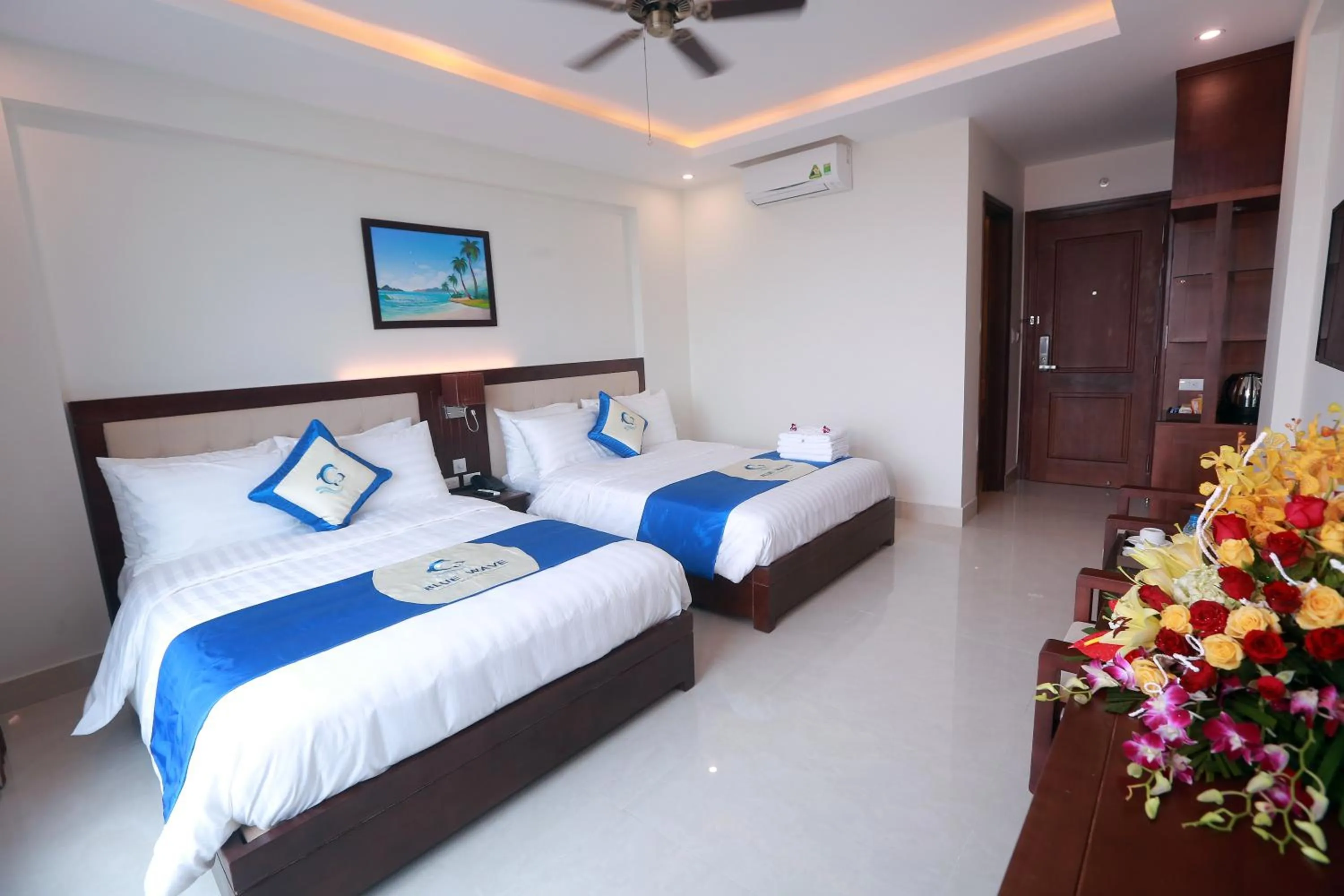 Bed in Blue Wave Hotel