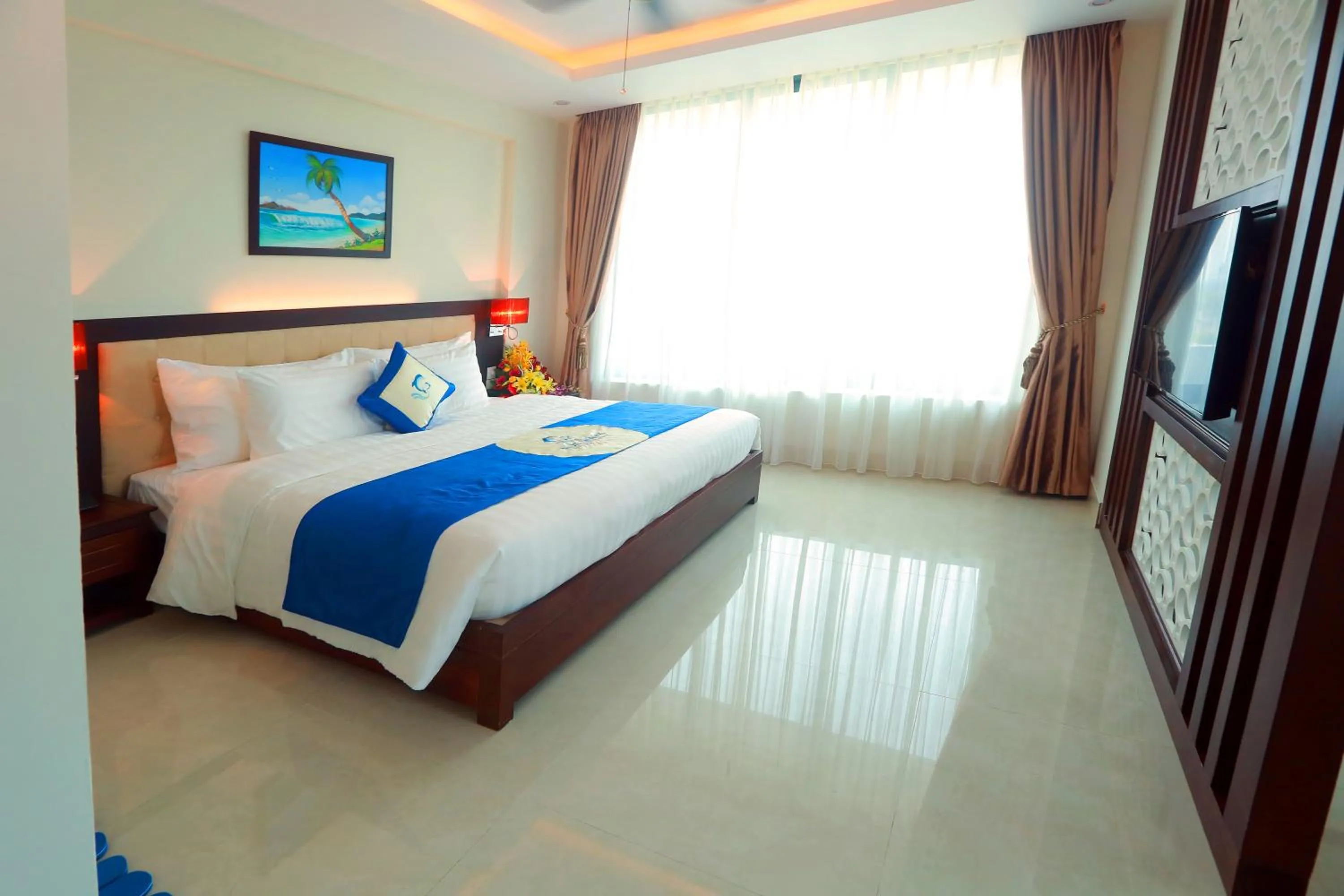 Bed in Blue Wave Hotel