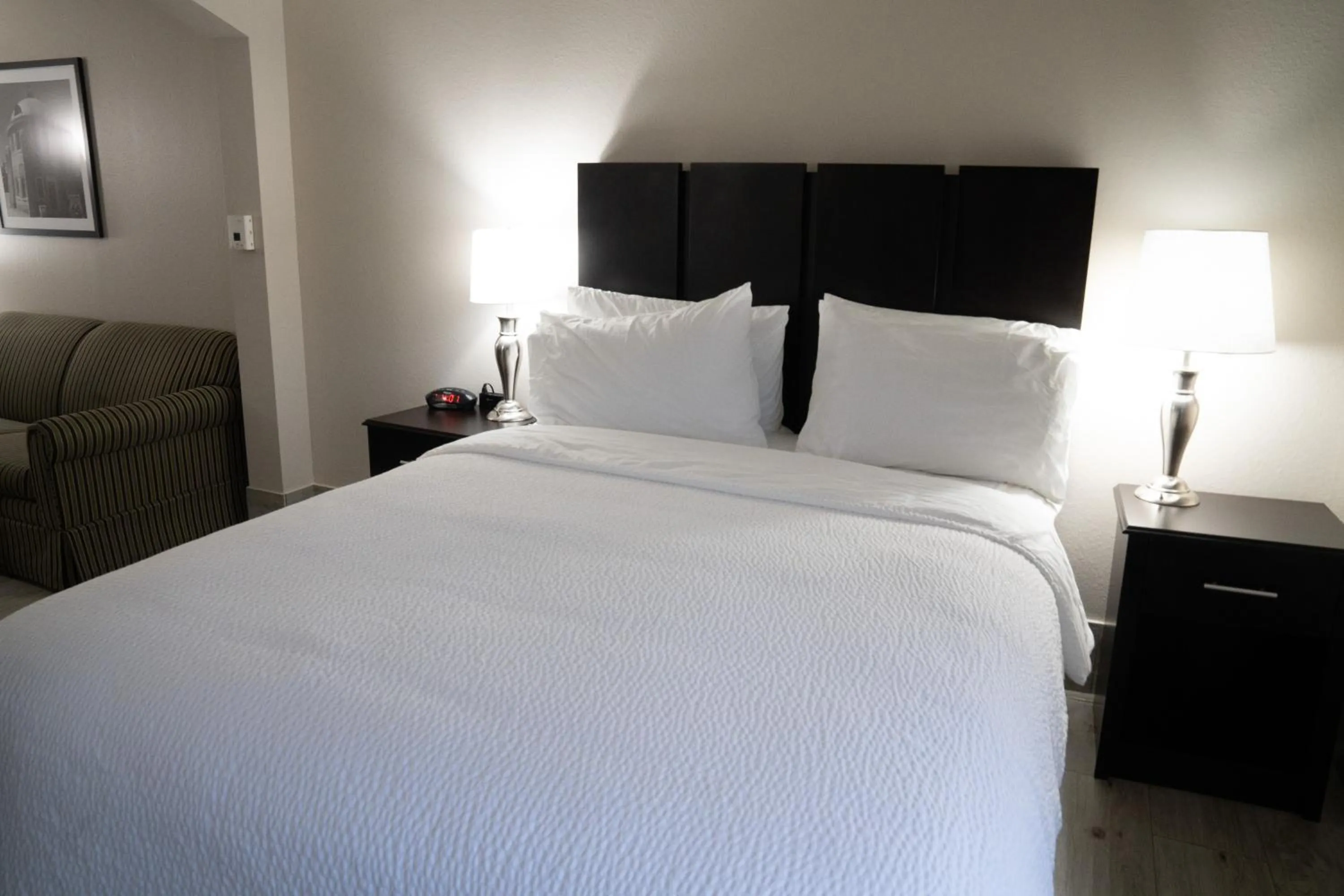 Bed in Lucille's Hotel, Restaurant, & Bar