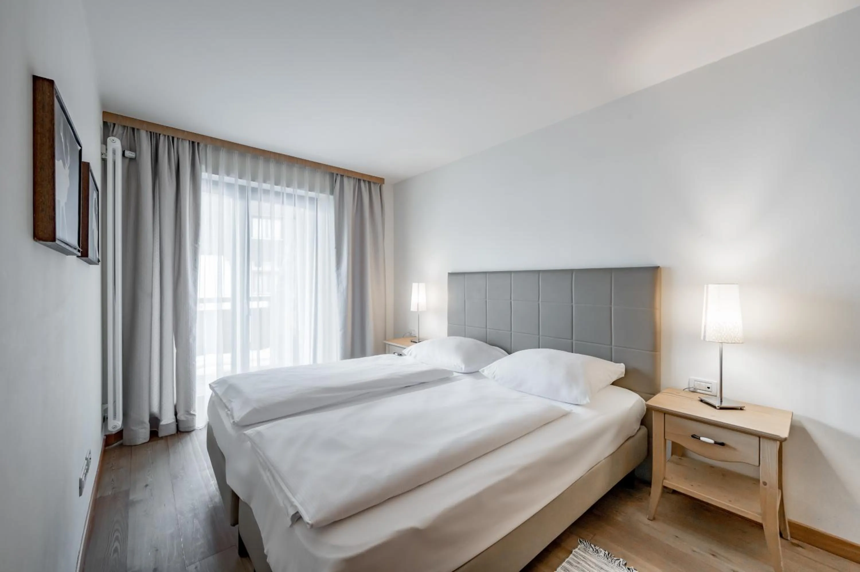 Bed in Apartment Torri di Seefeld