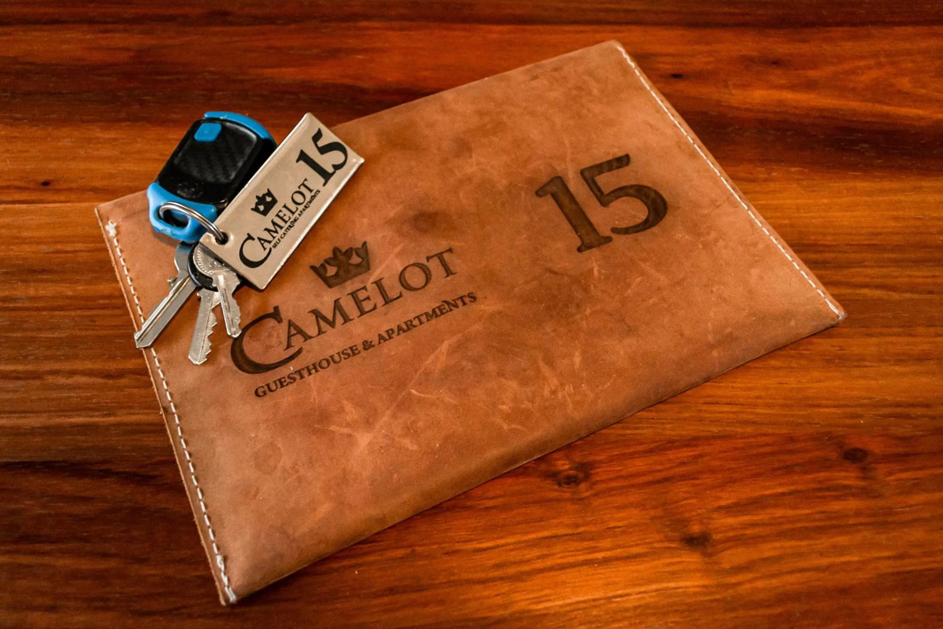 Property logo or sign in Camelot Guest House & Apartments