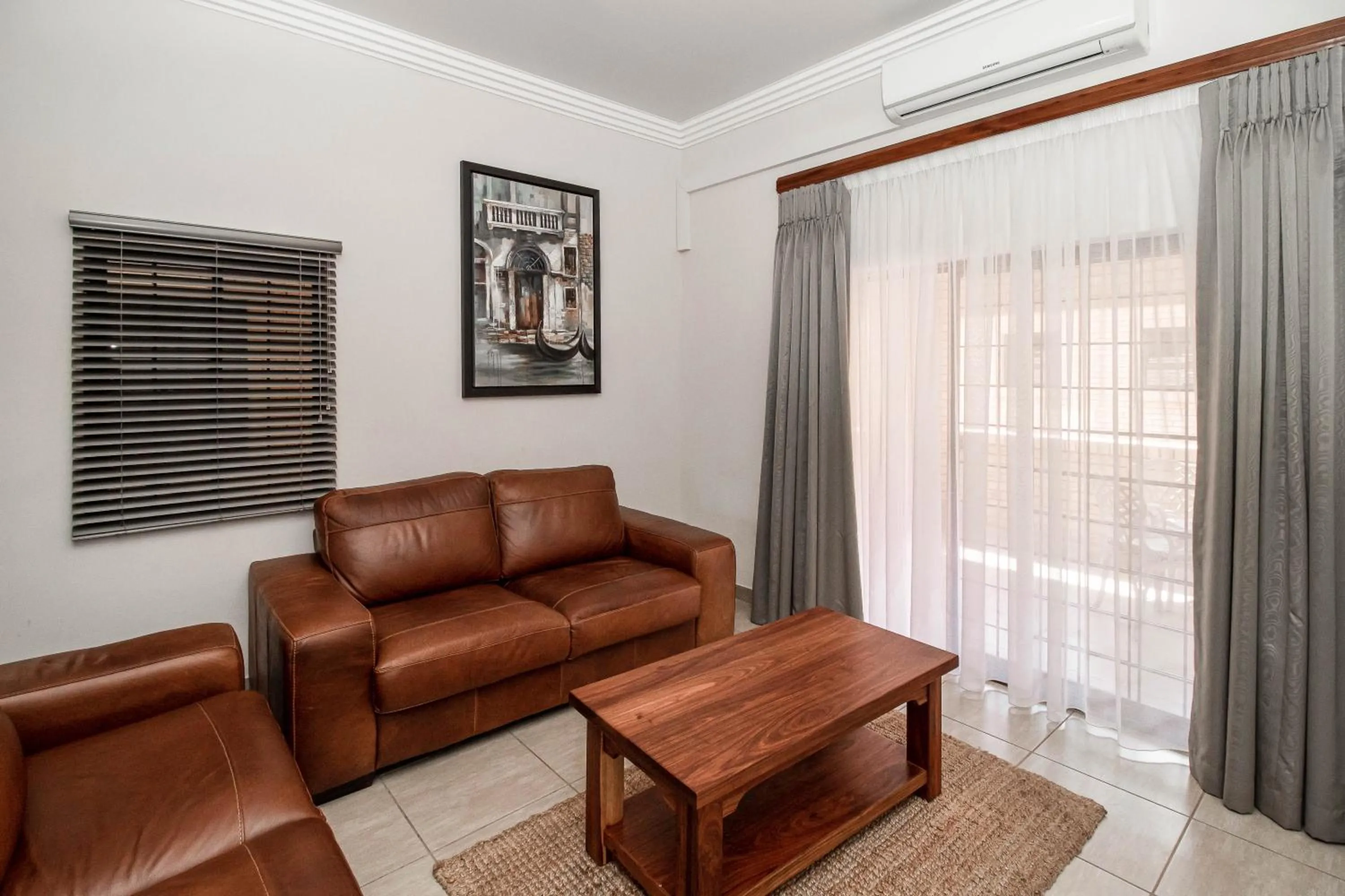 Living room in Camelot Guest House & Apartments