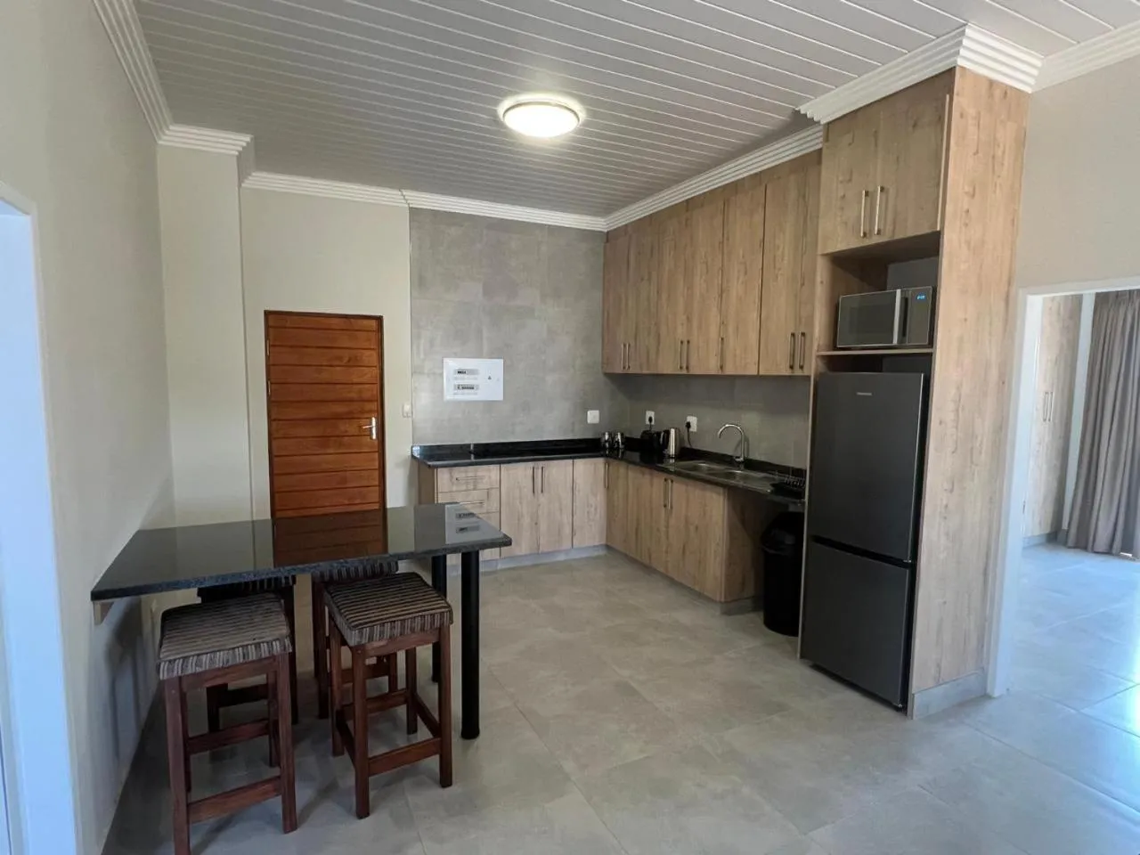 Kitchen or kitchenette in Camelot Guest House & Apartments