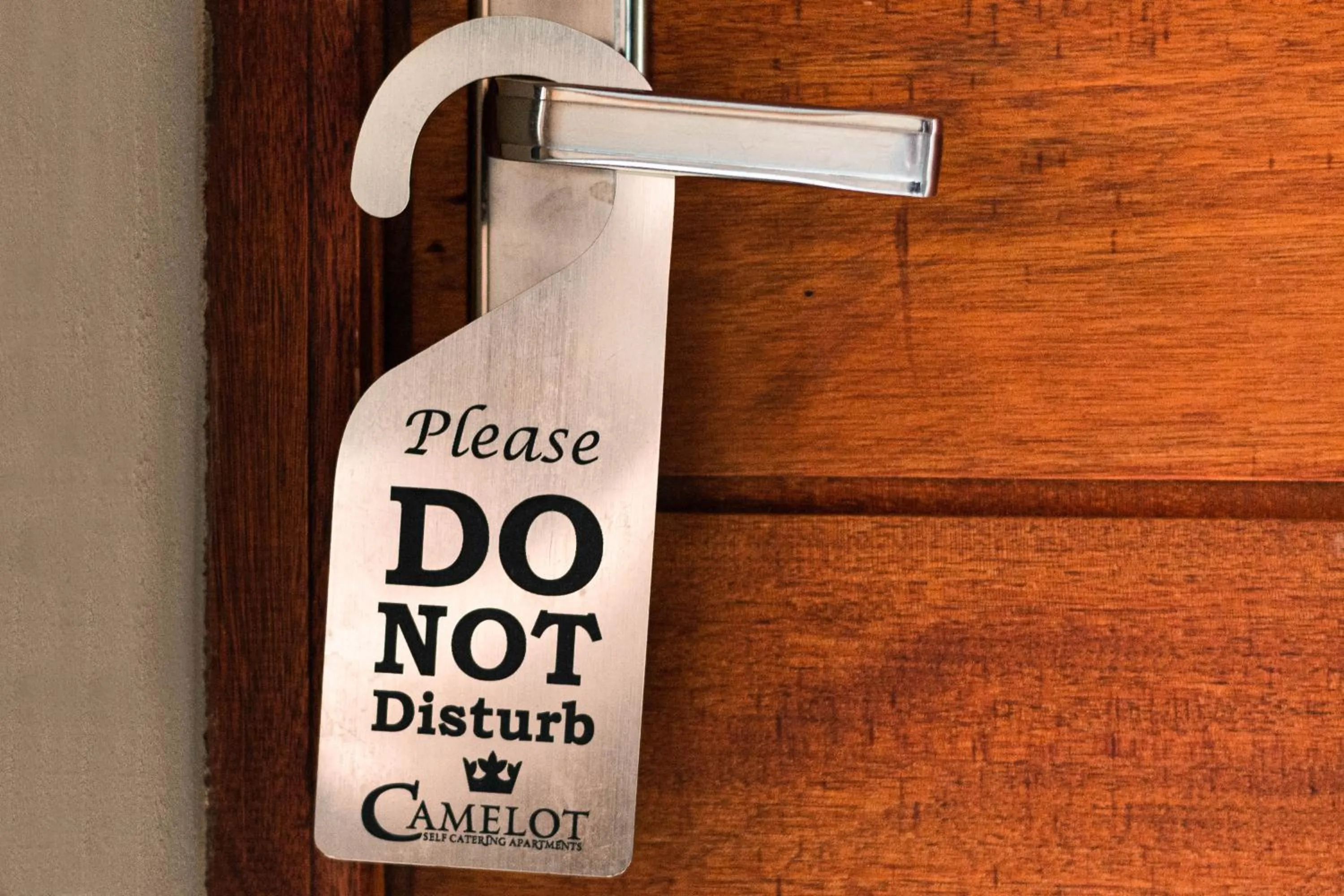 Logo/Certificate/Sign in Camelot Guest House & Apartments