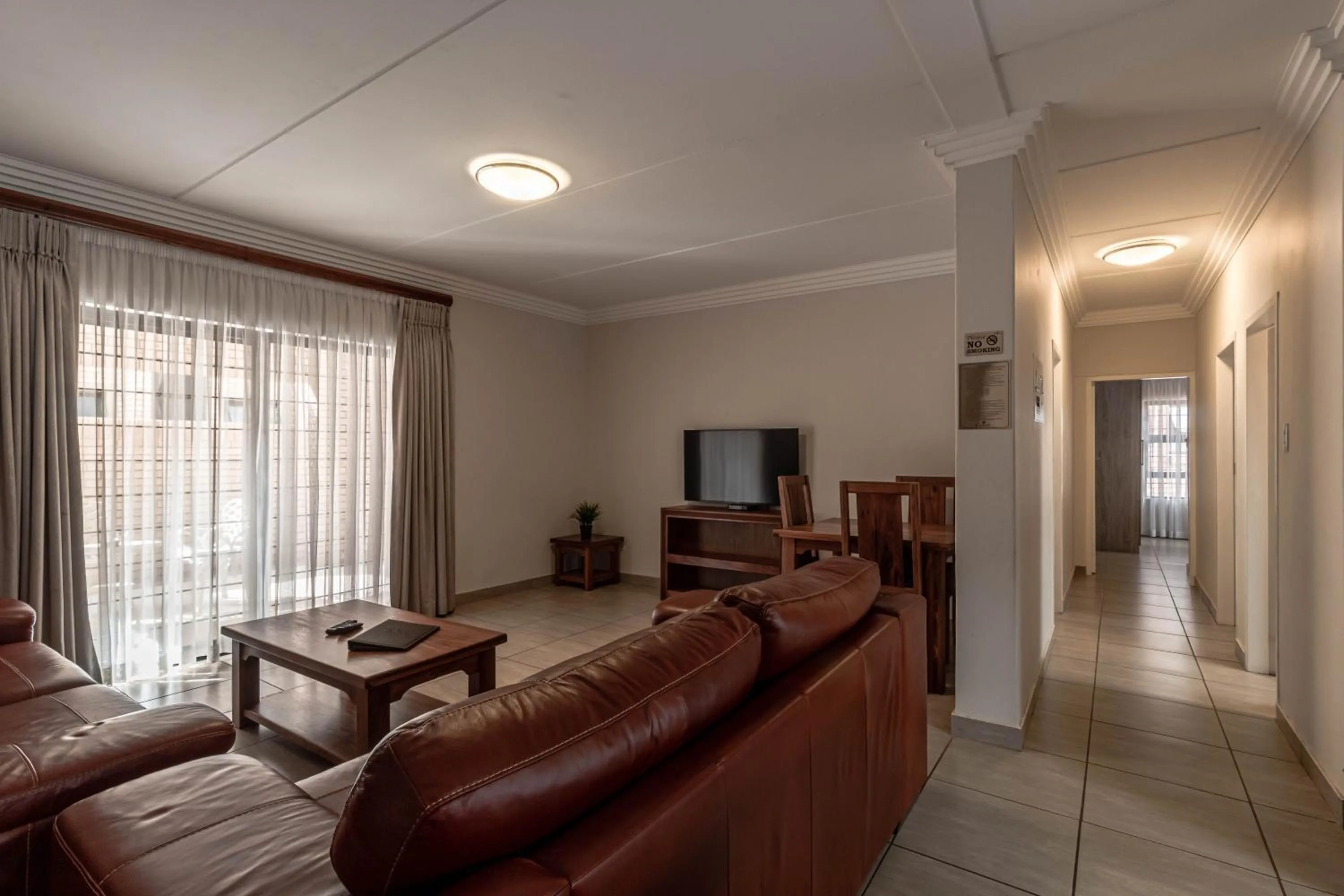 Living room in Camelot Guest House & Apartments