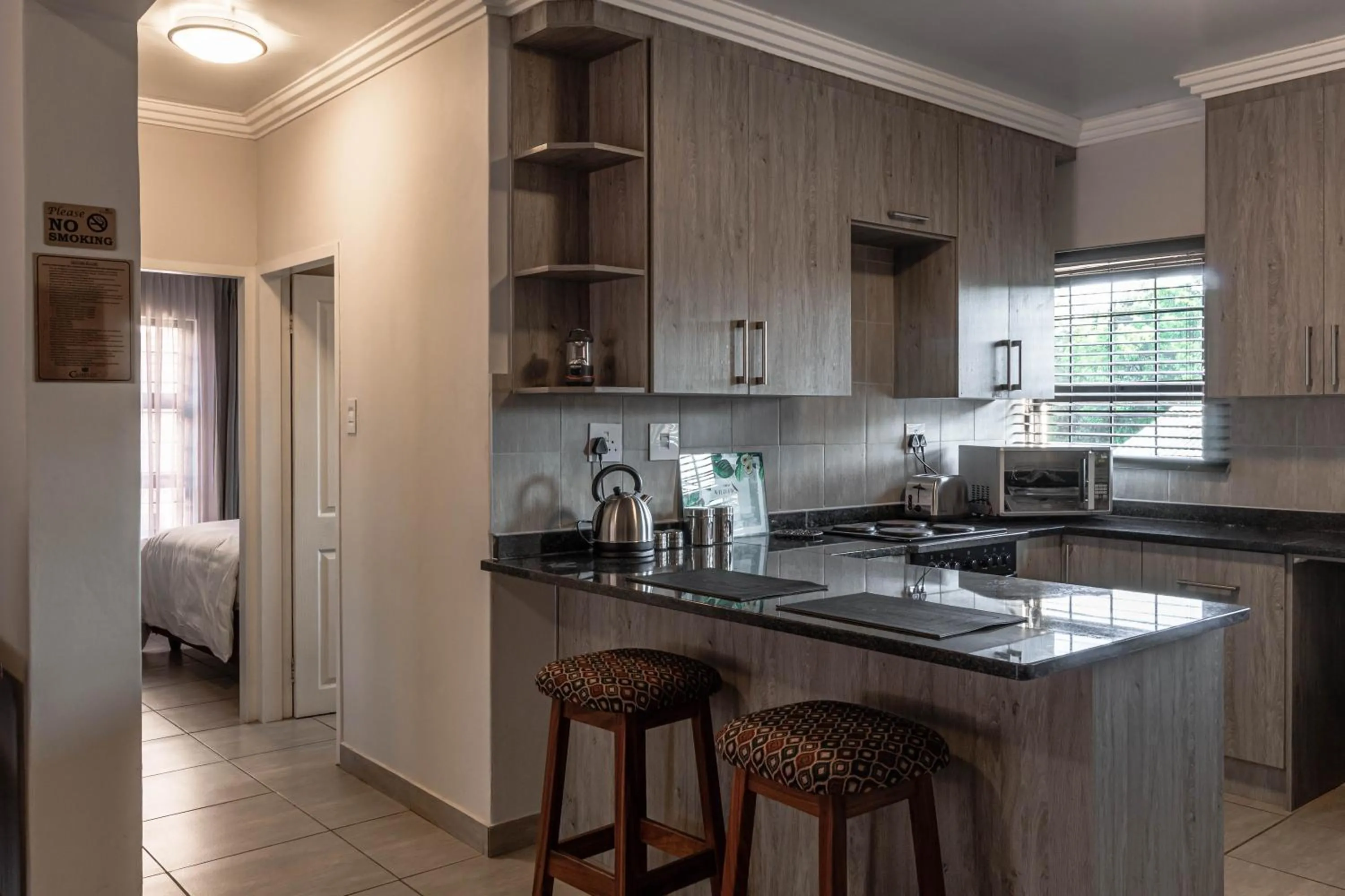 Kitchen or kitchenette in Camelot Guest House & Apartments