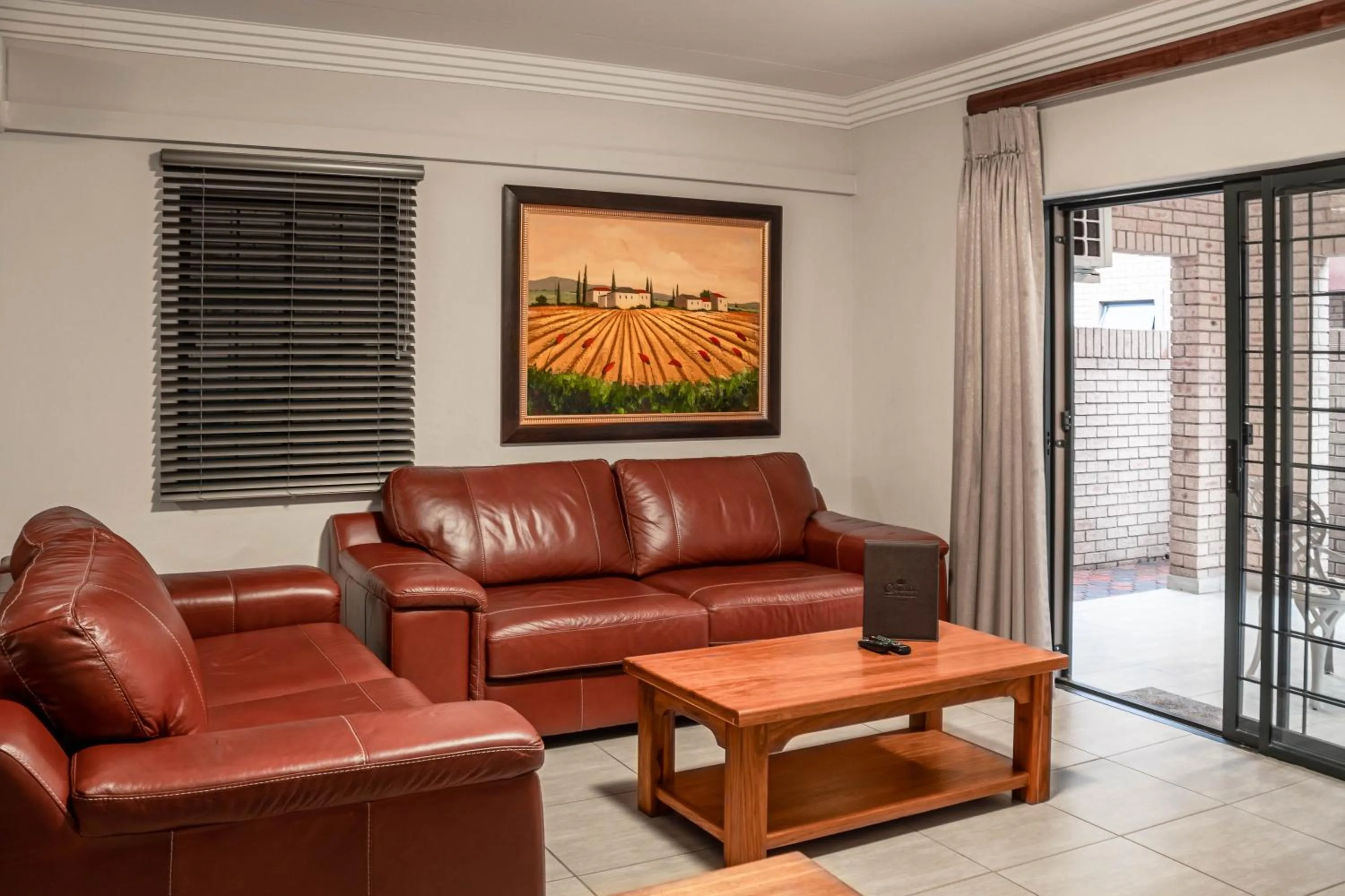 Living room in Camelot Guest House & Apartments