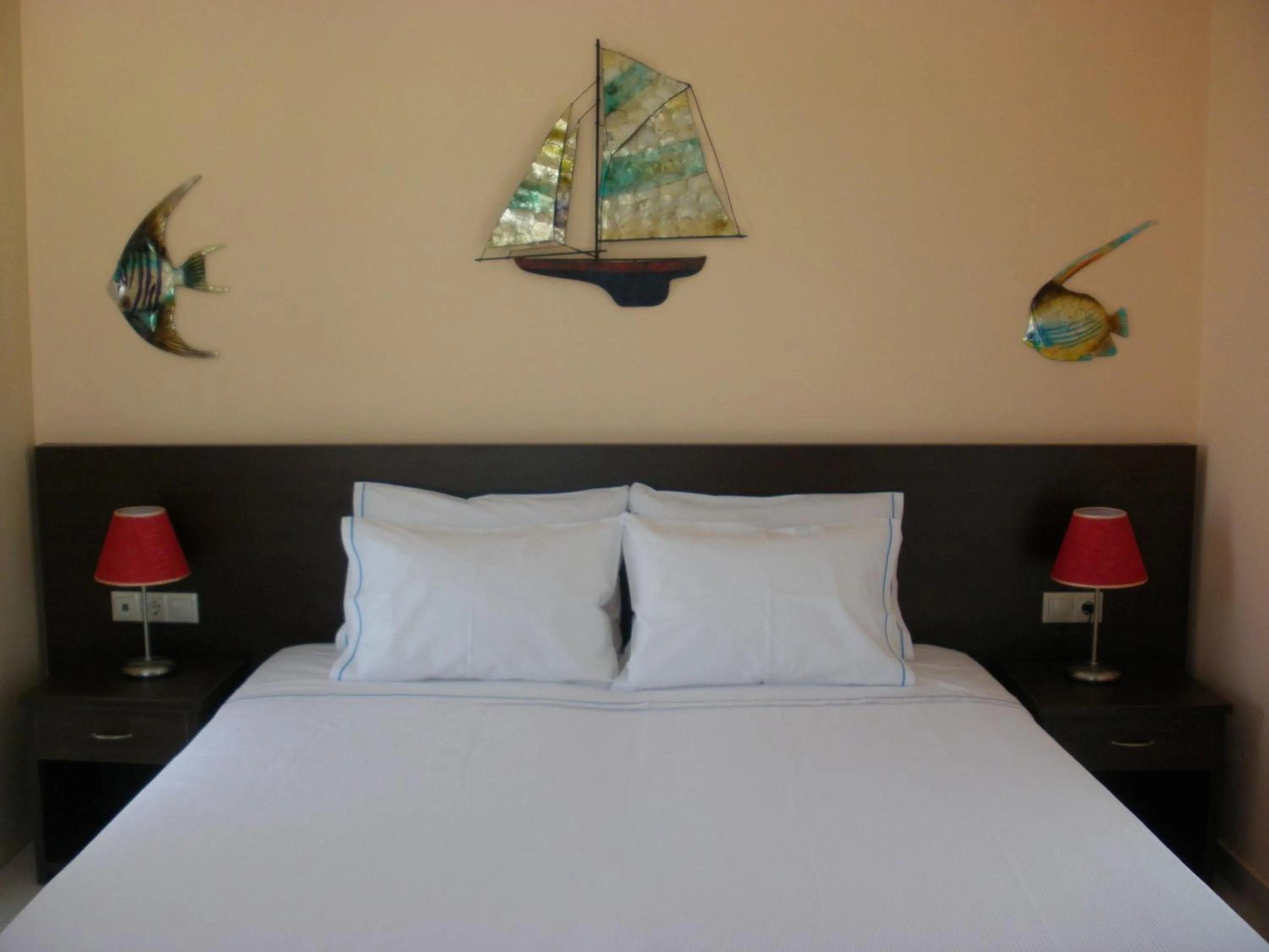 Property building, Bed in Blue Harmony Apartments