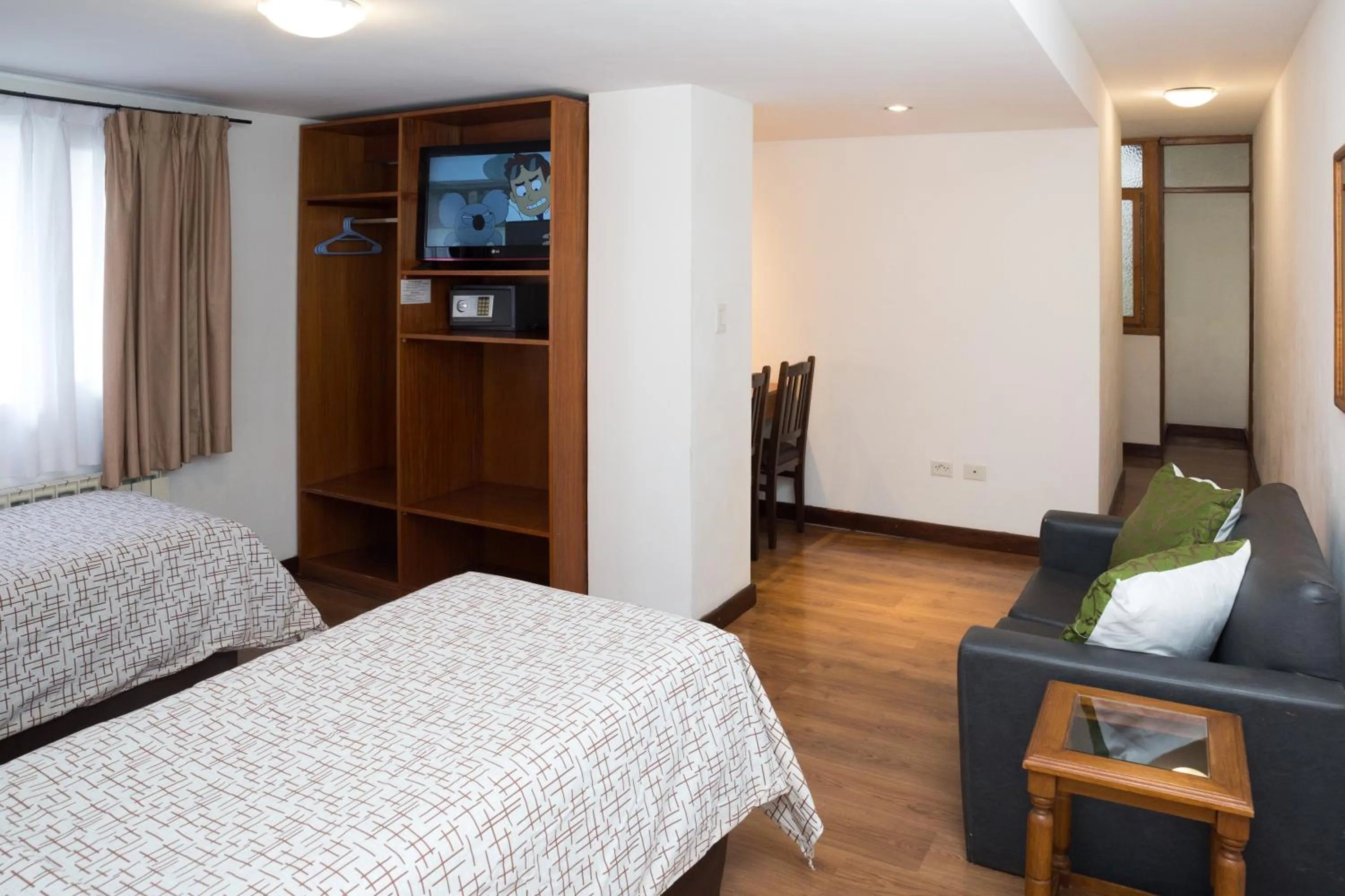 Bed in NBH Premier Hotel