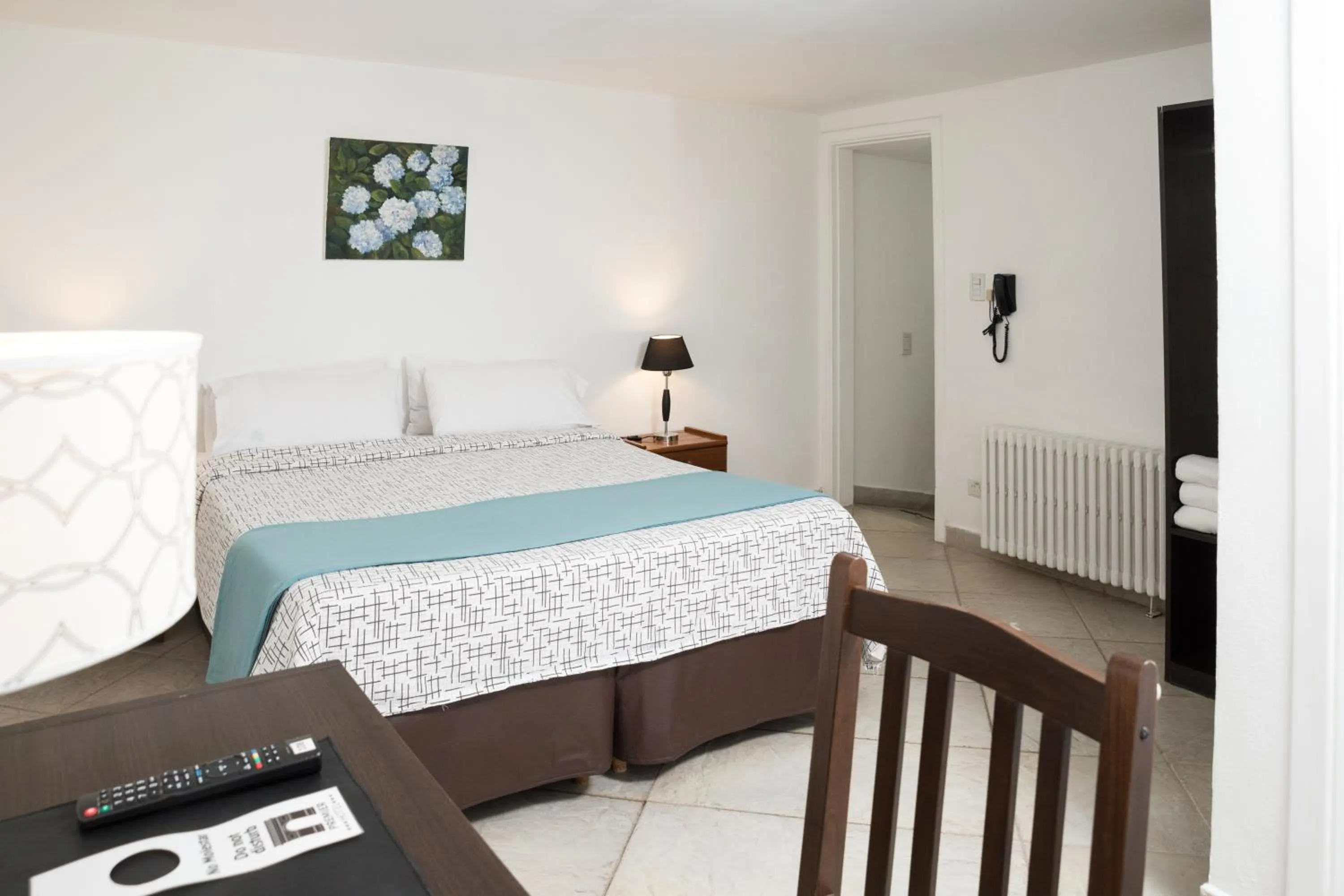 Bed in NBH Premier Hotel