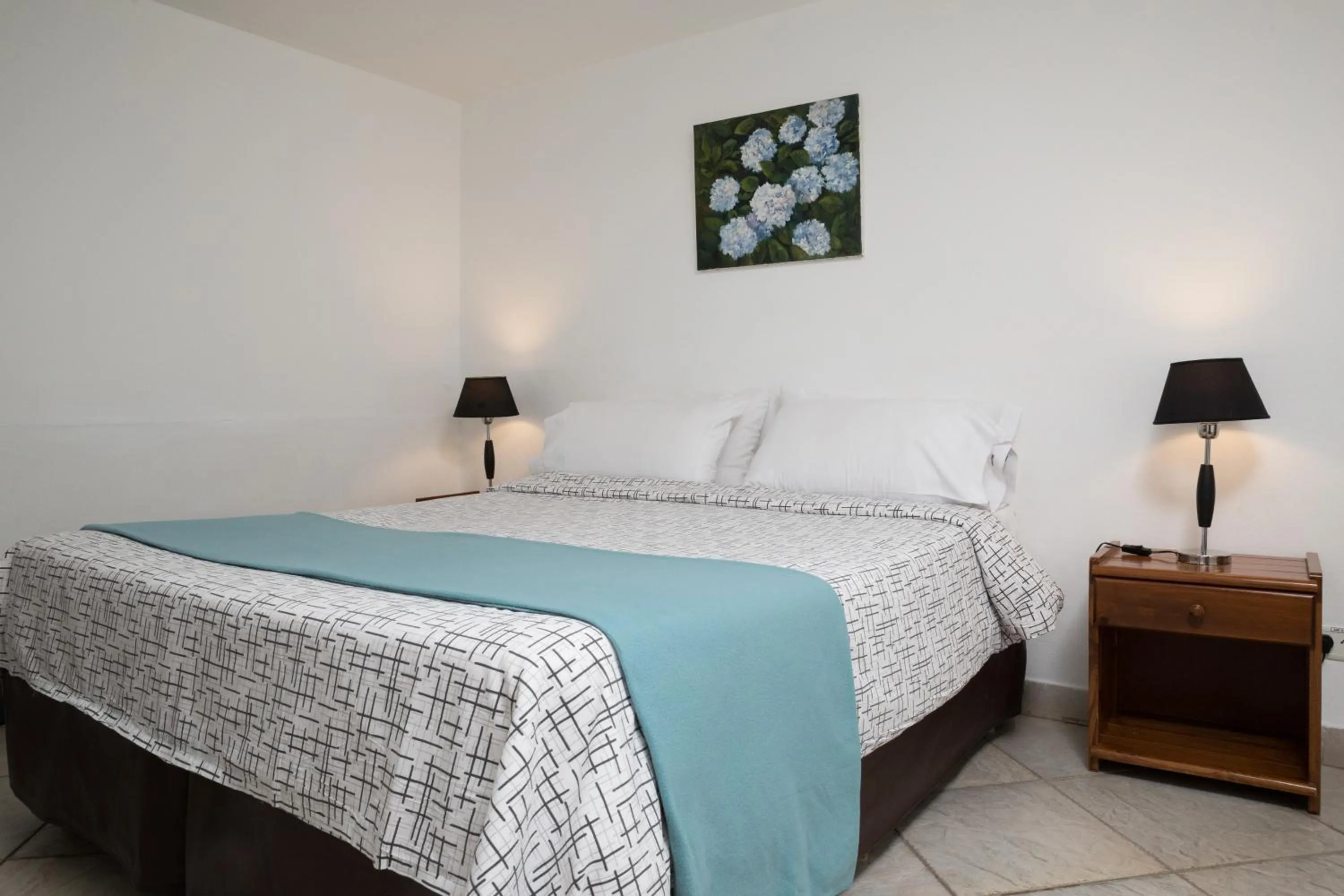 Bed in NBH Premier Hotel