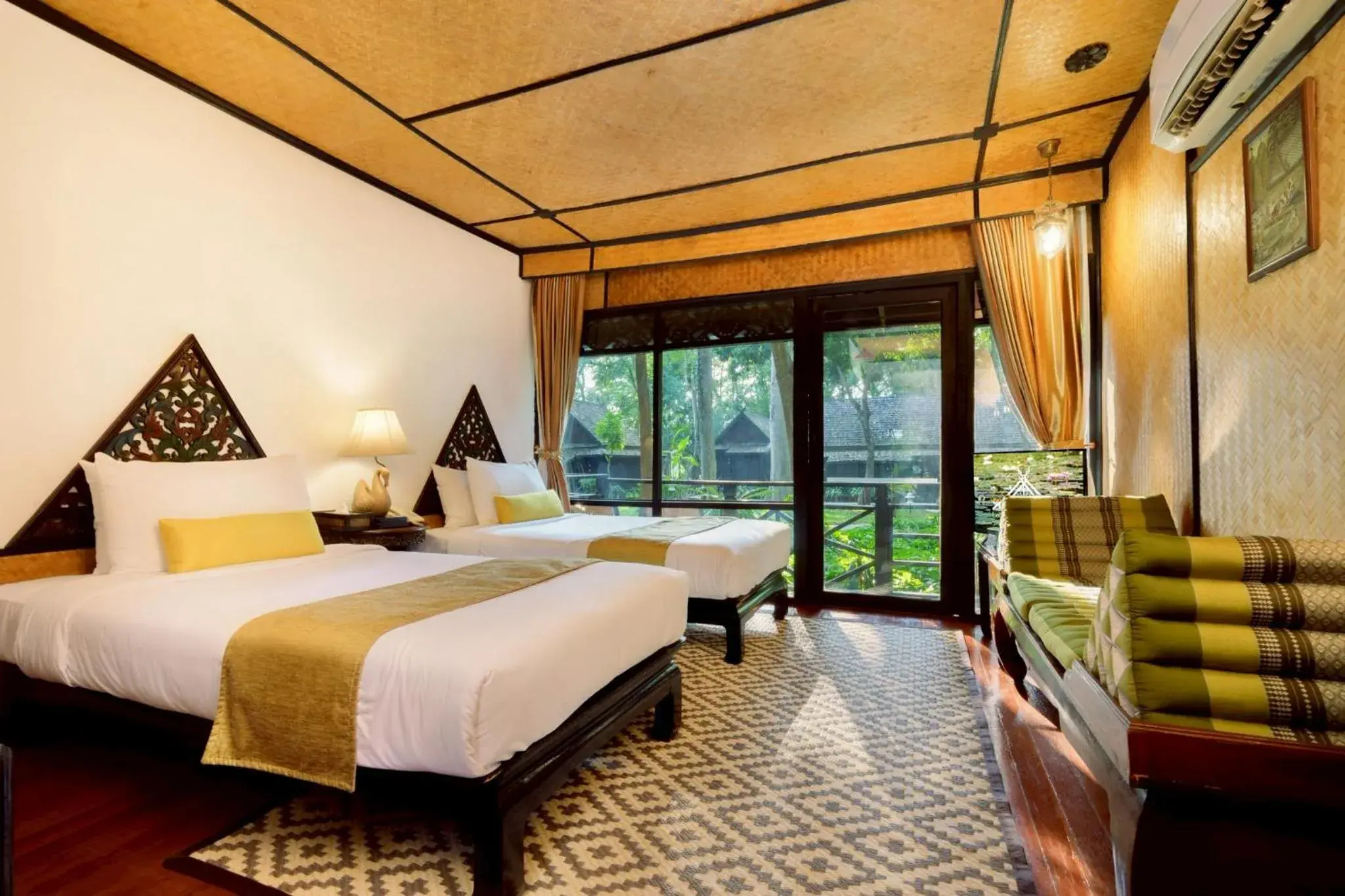 Bed in Lampang River Lodge Bed in Lampang River Lodge