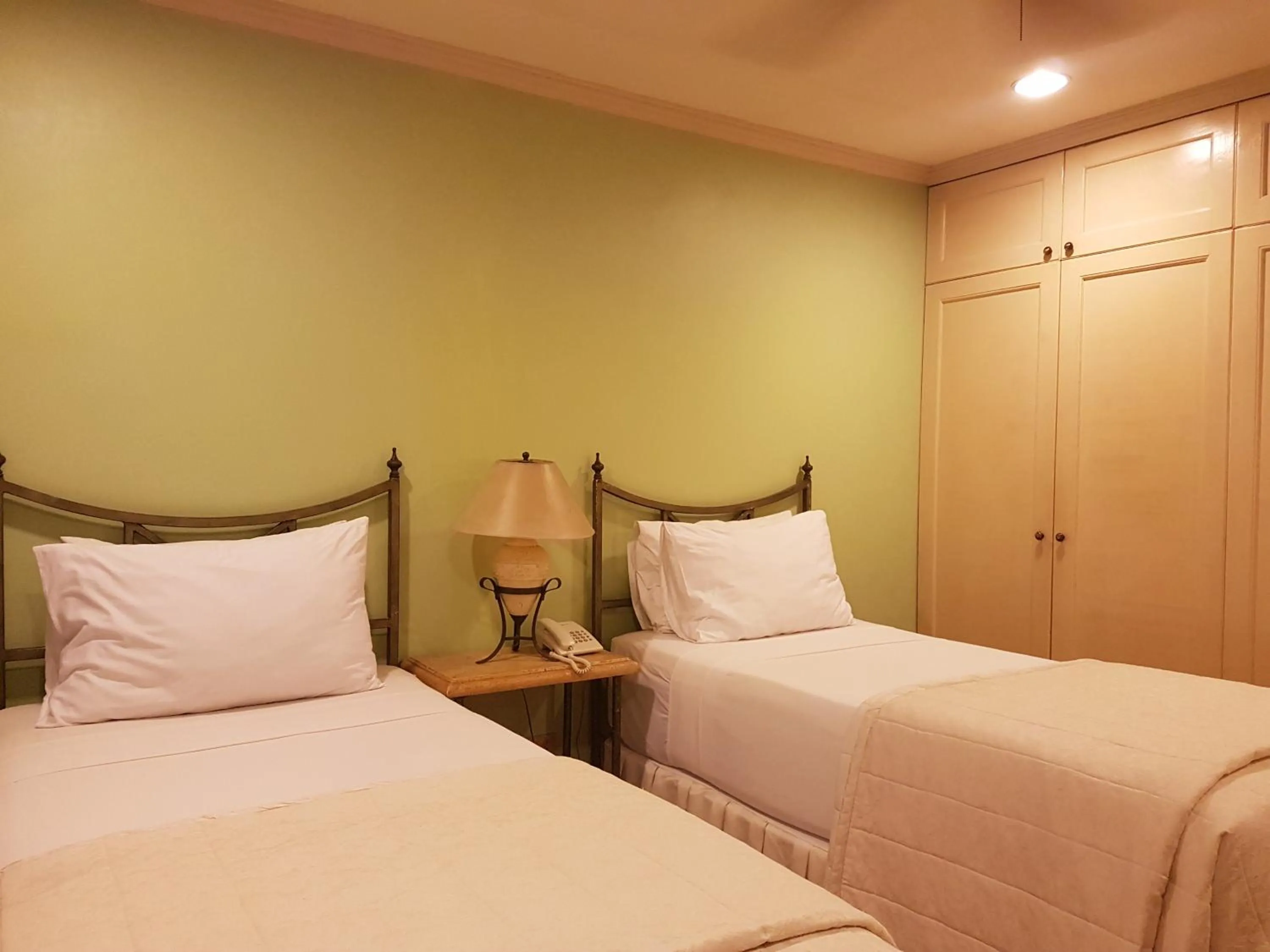 Bed in Sophia Suites Residence Hotel