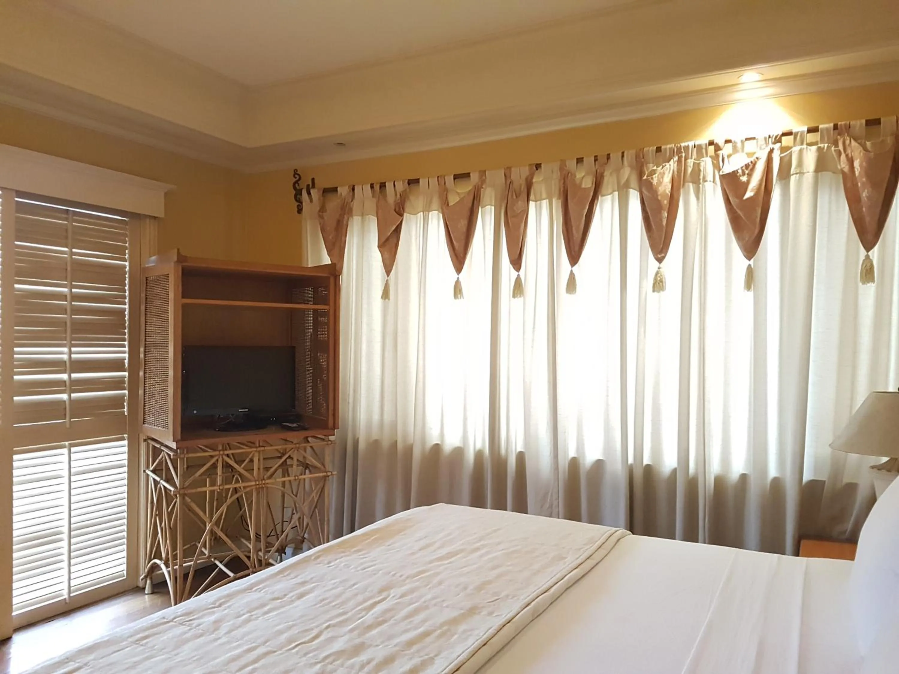 Bed in Sophia Suites Residence Hotel