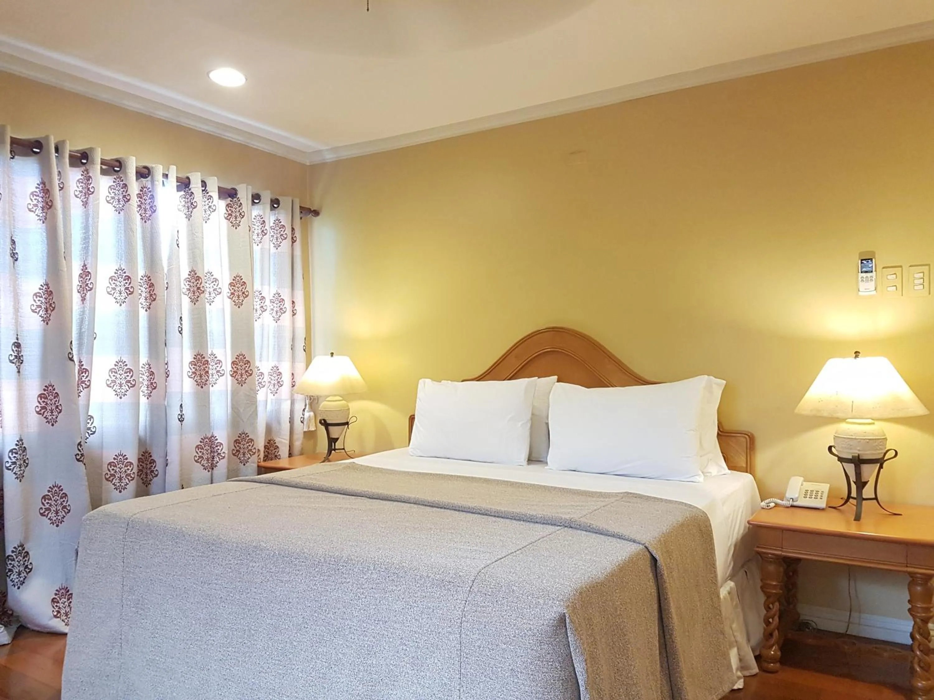 Bed in Sophia Suites Residence Hotel