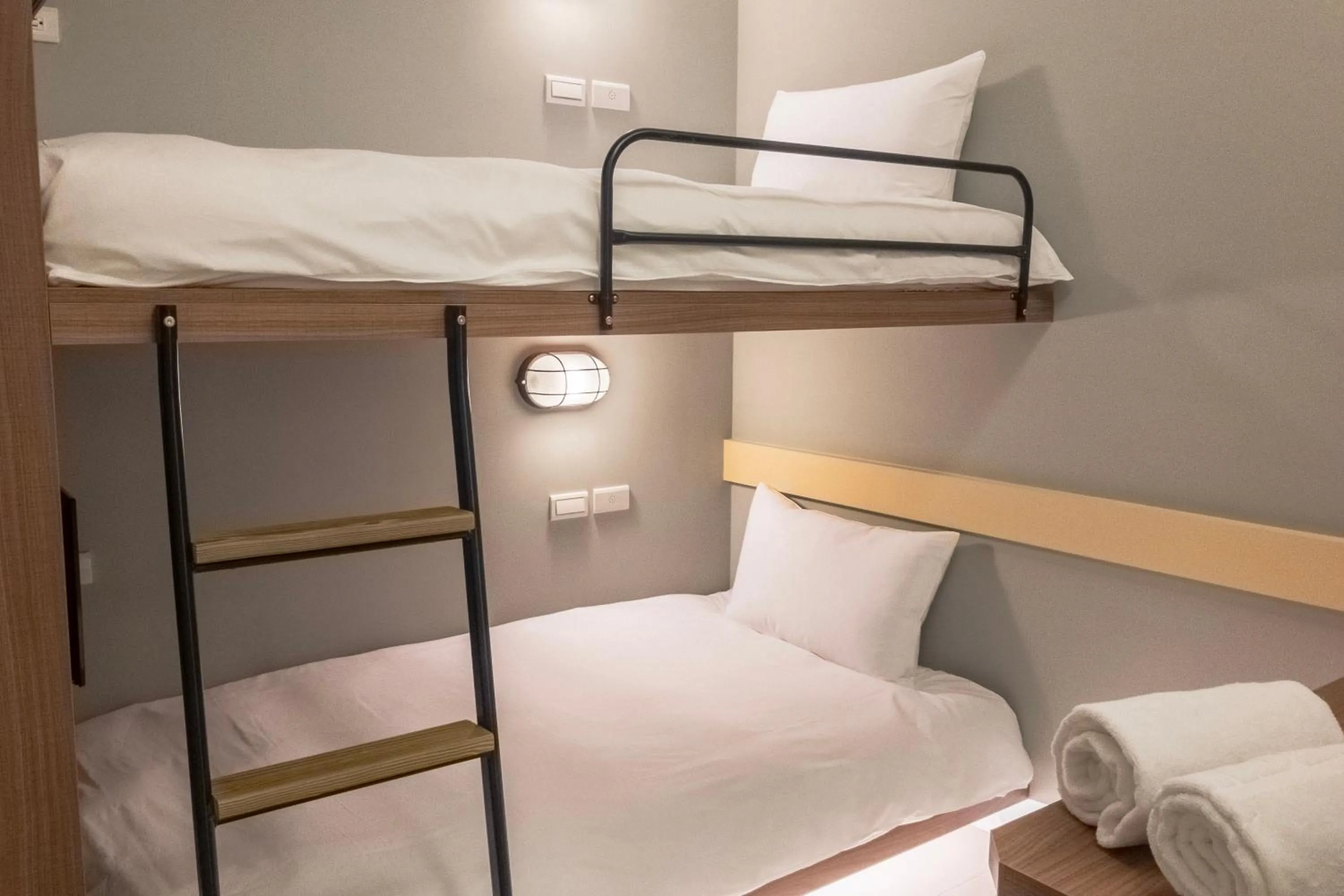 Bed in Divecube Hotel