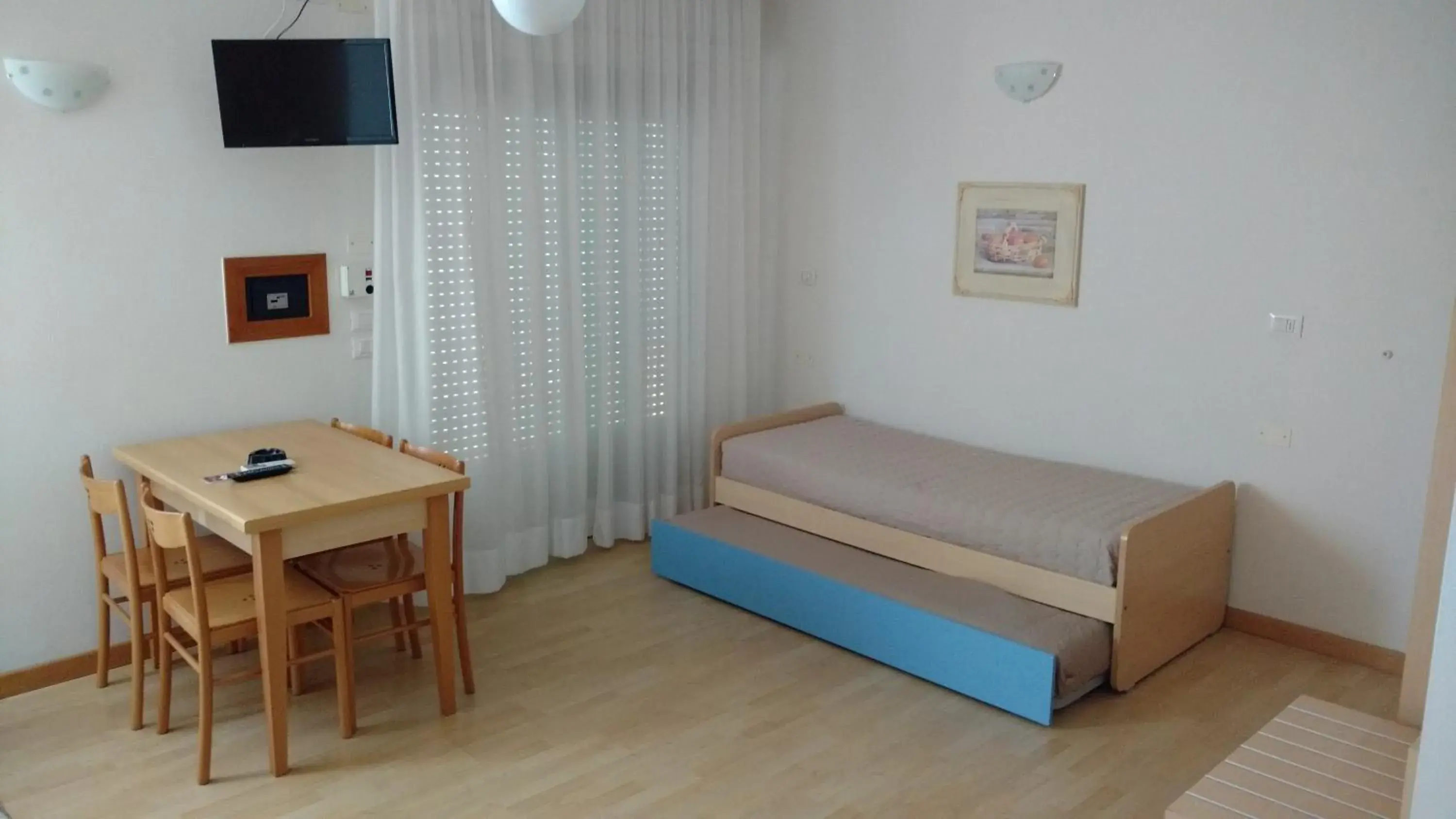 Bed, Seating Area in Hotel La Brezza