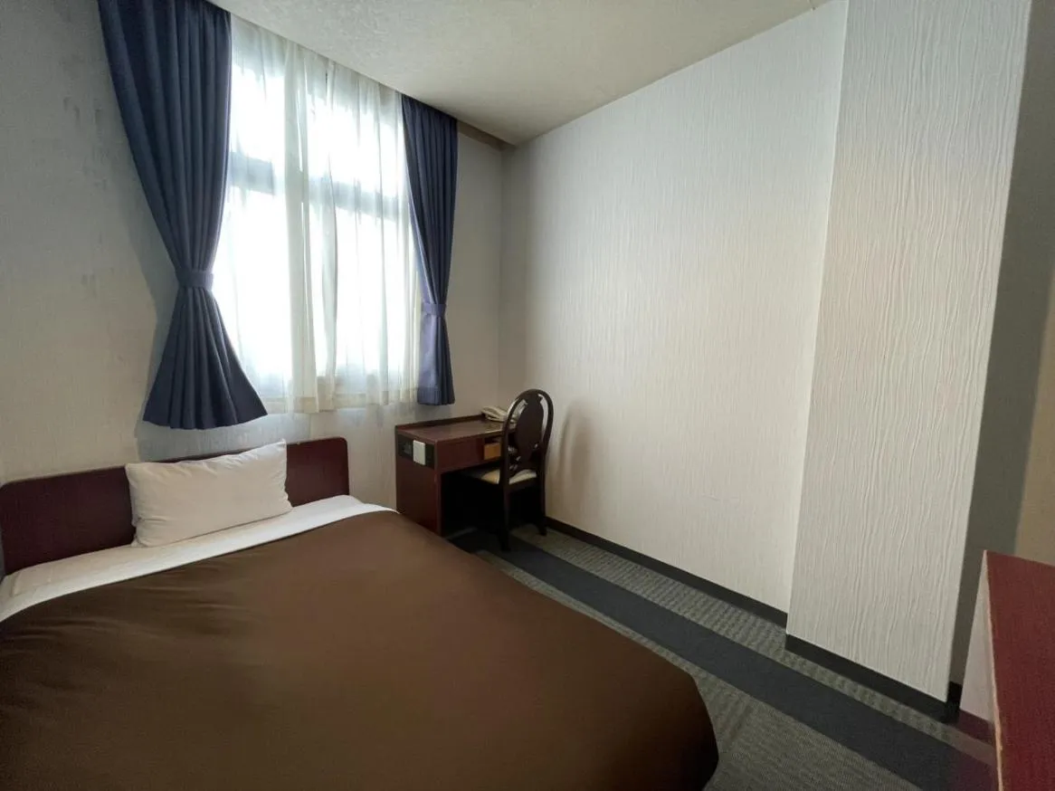 Photo of the whole room, Bed in Zentsuji Grand Hotel