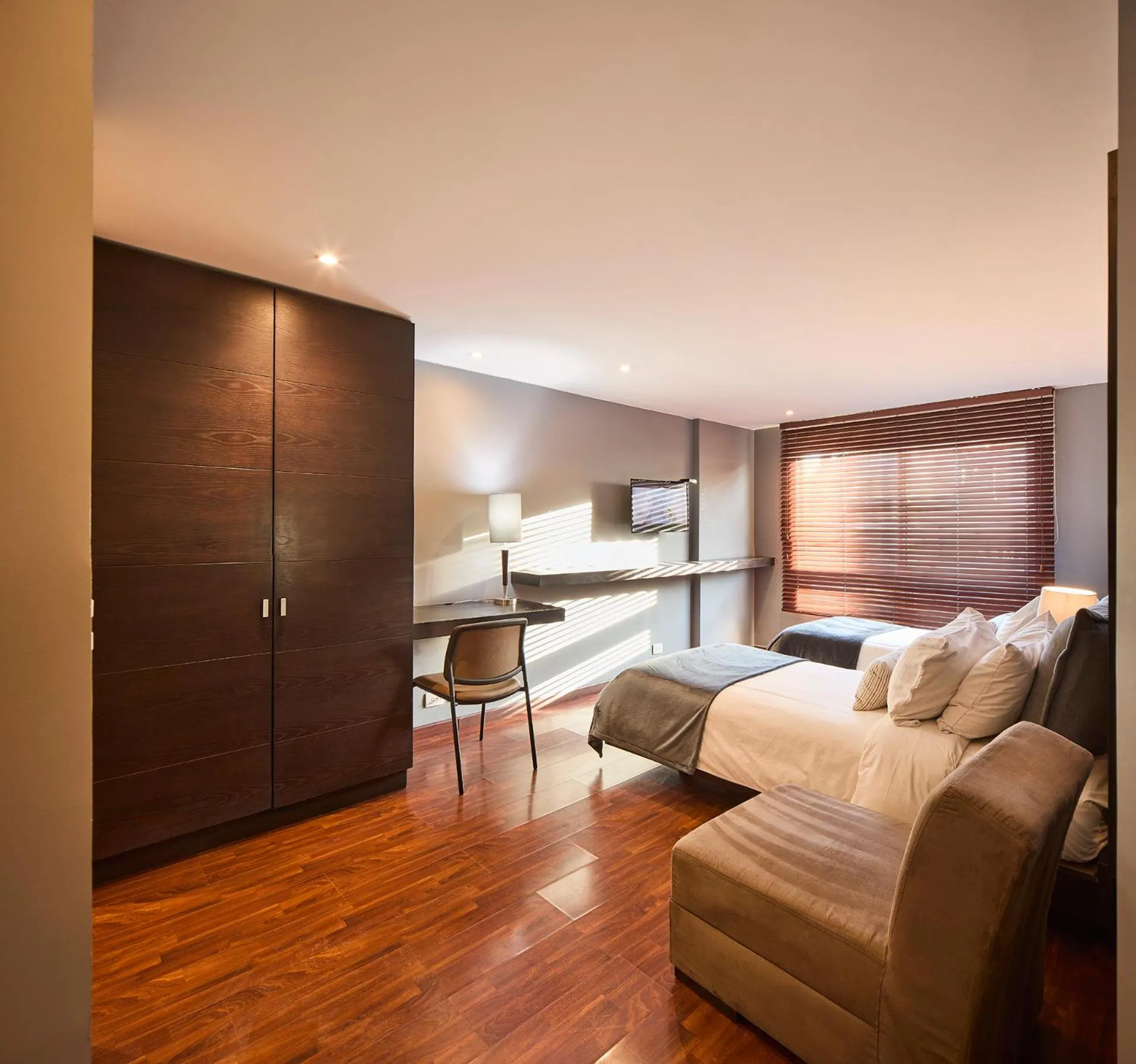 Bed in Nico Apartasuites