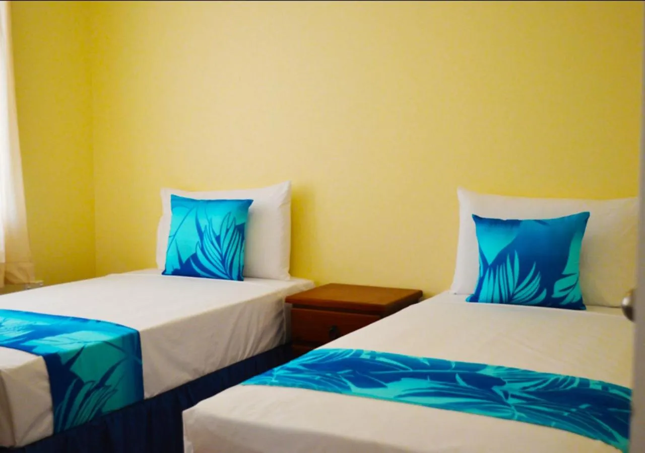 Bed in The Edgewater Resort & Spa