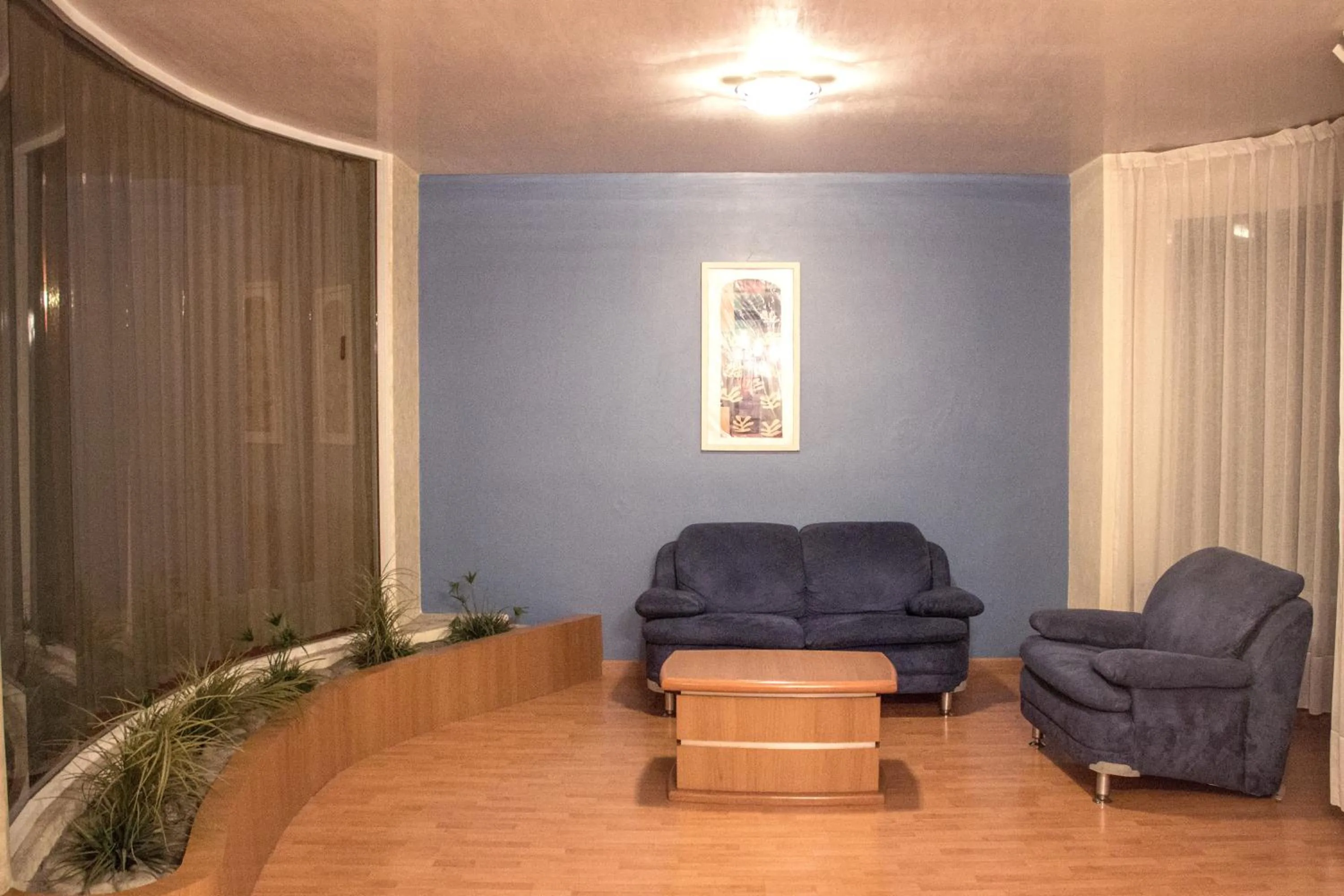 Living room in Autohotel Ilussion