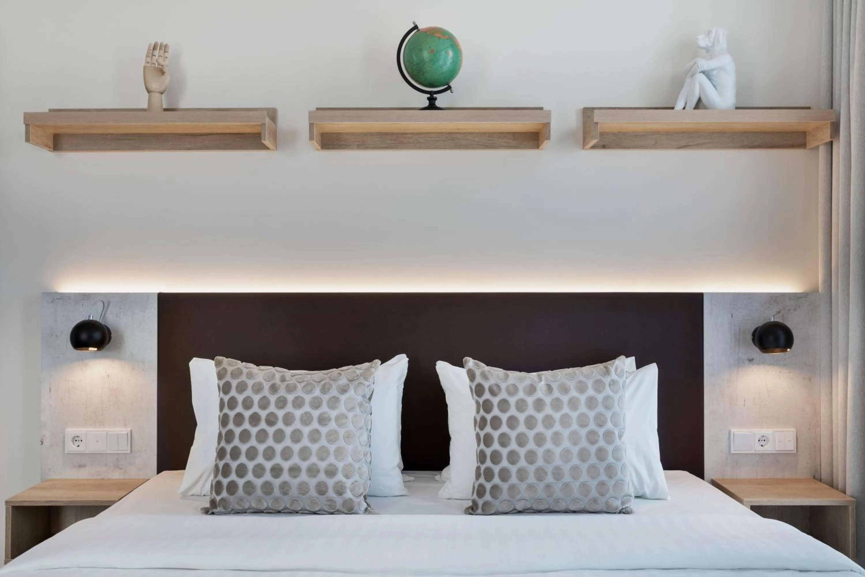 Bed in Stellaris Apartment Hotel