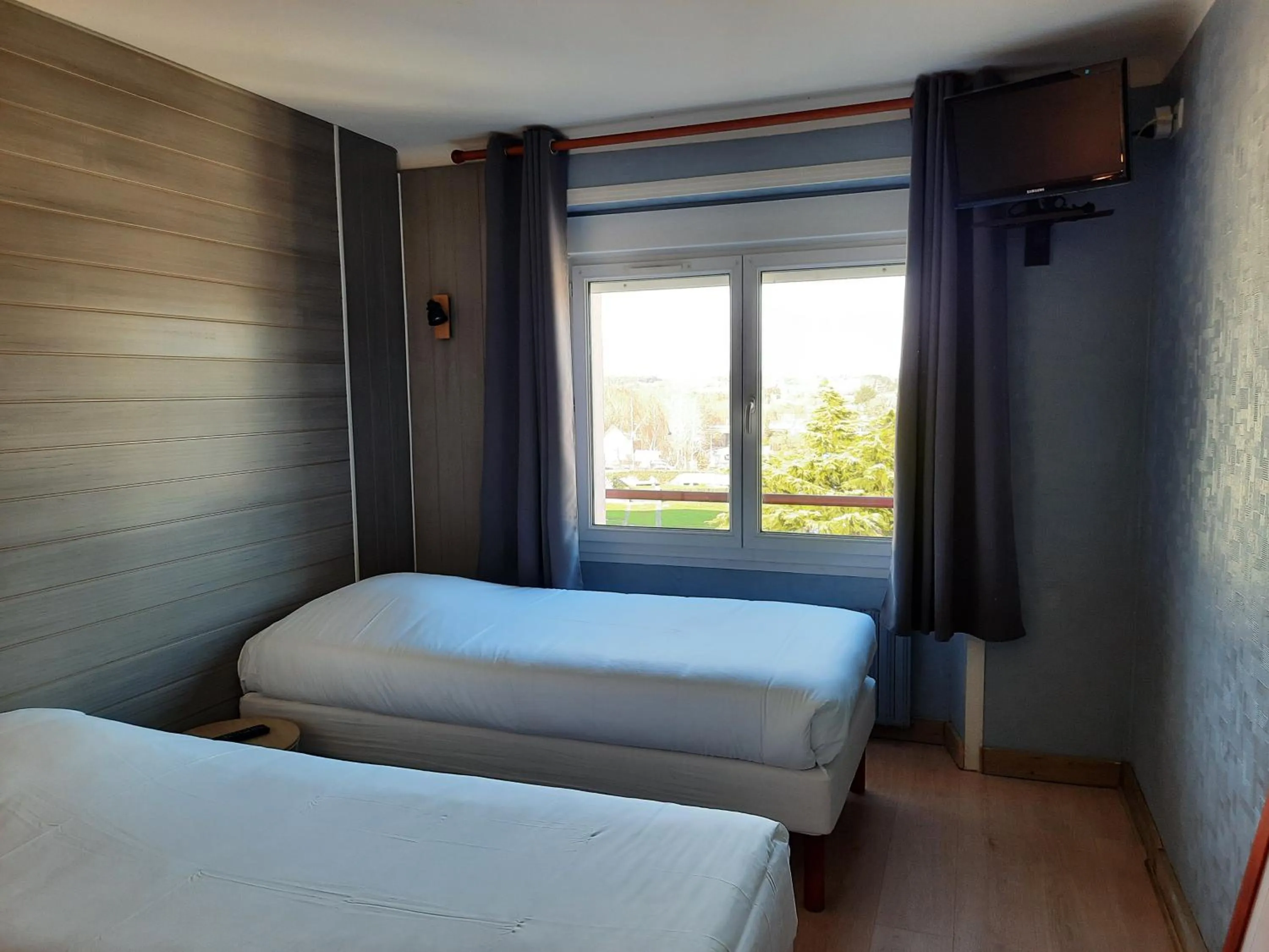 Bed in Hôtel des îles