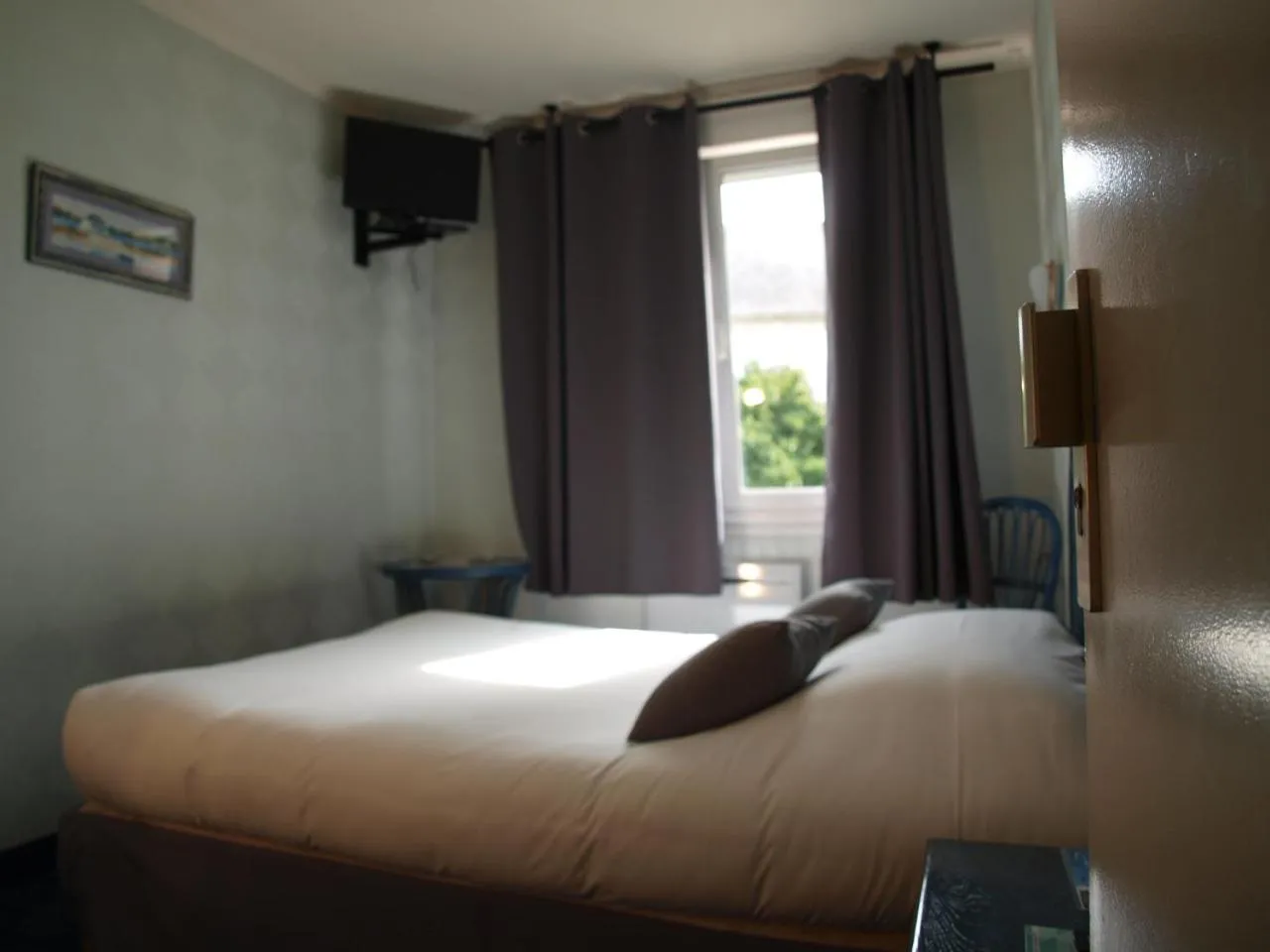 Bed in Hôtel des îles