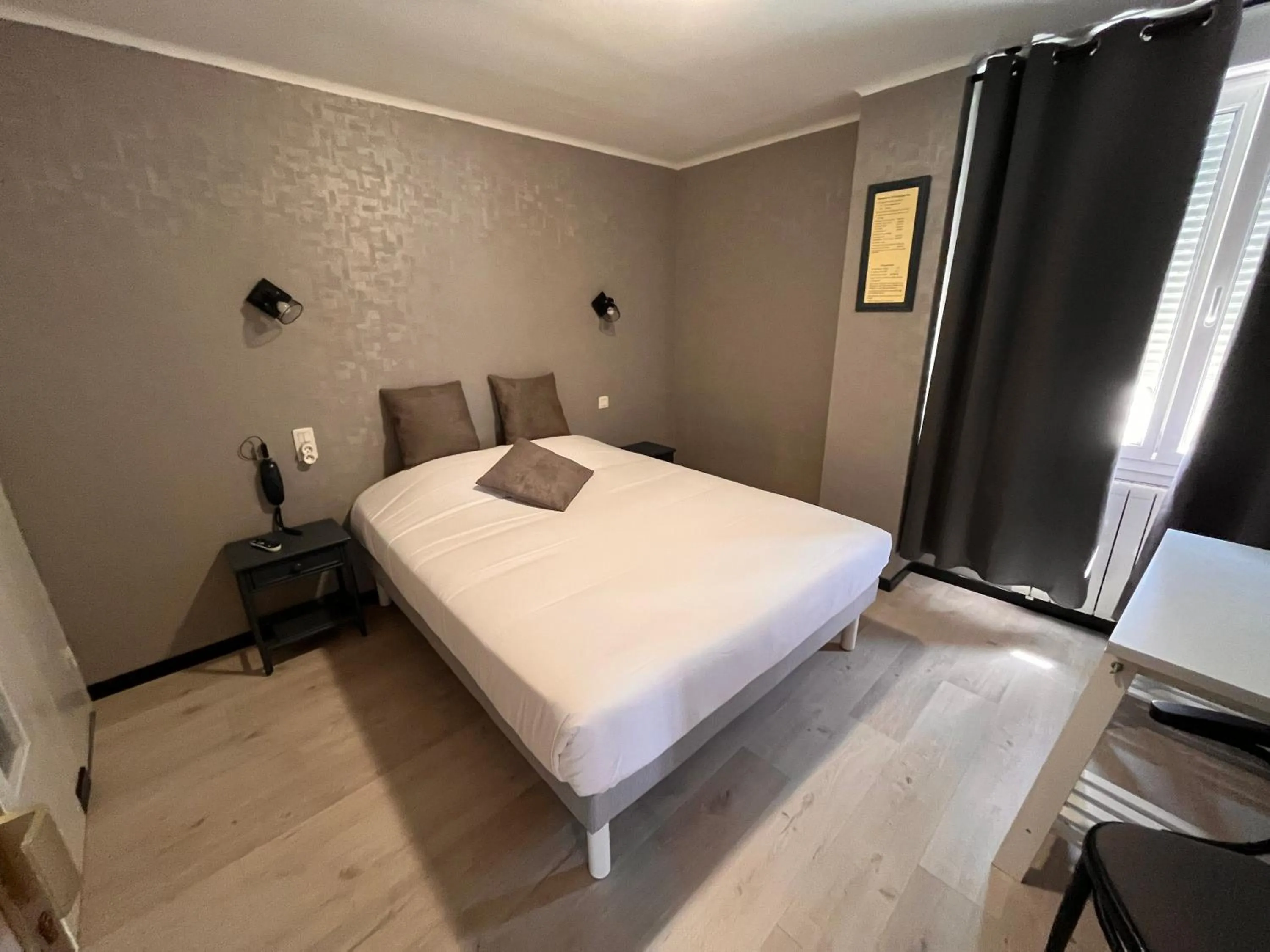 Bed in Hôtel des îles