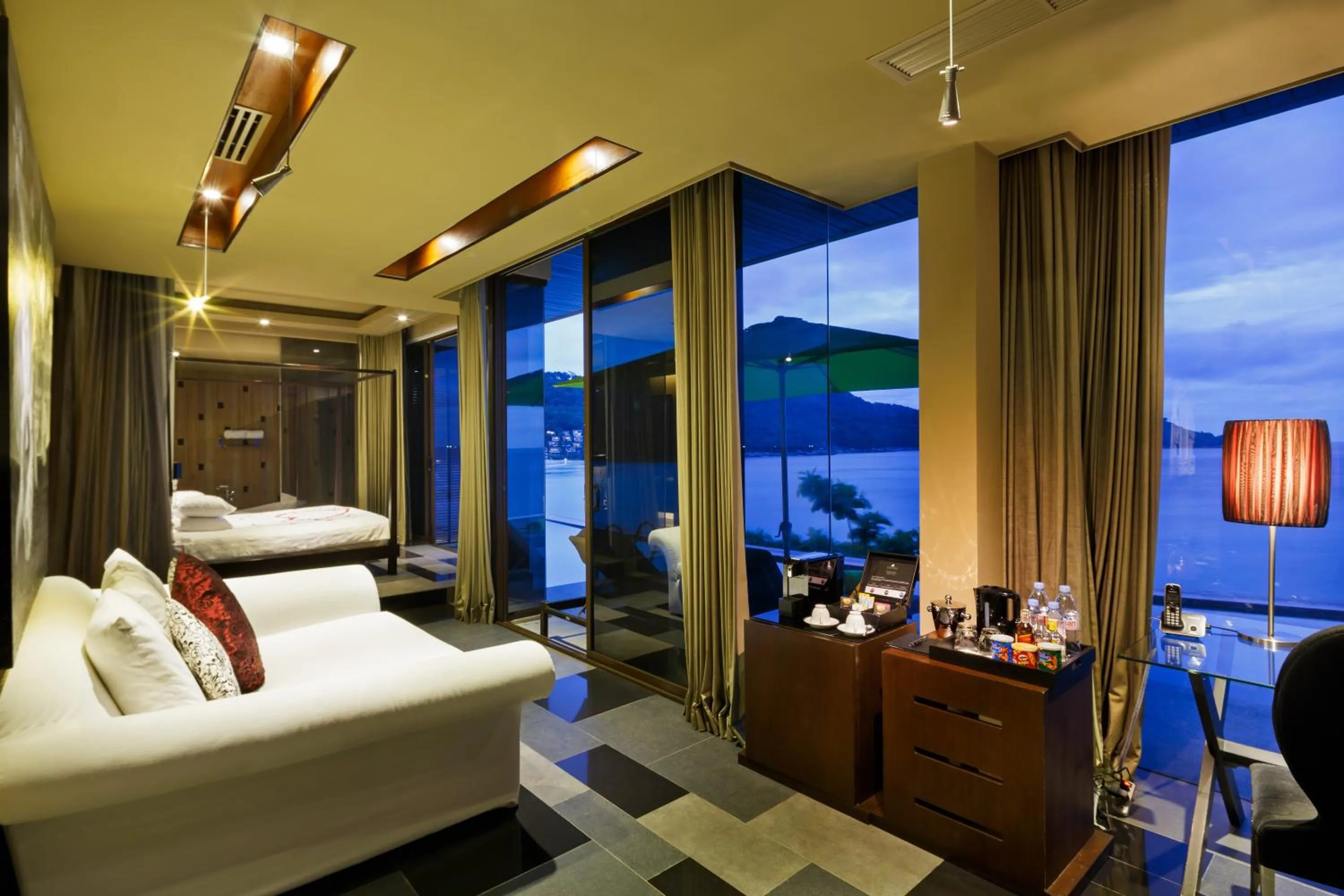 Seating area, Bed in Impiana Private Villas Kata Noi