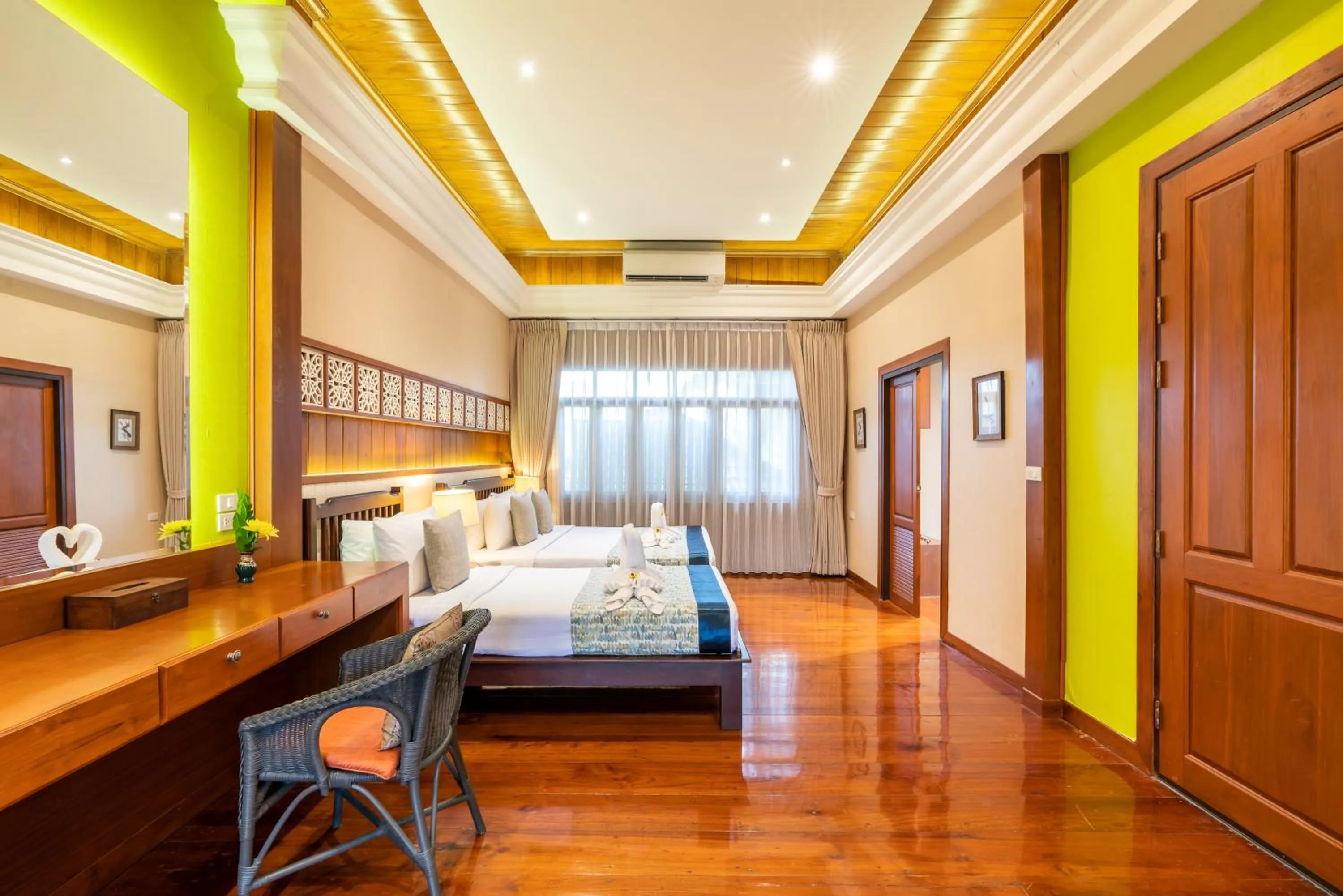 Bed in Le Charme Sukhothai Historical Park