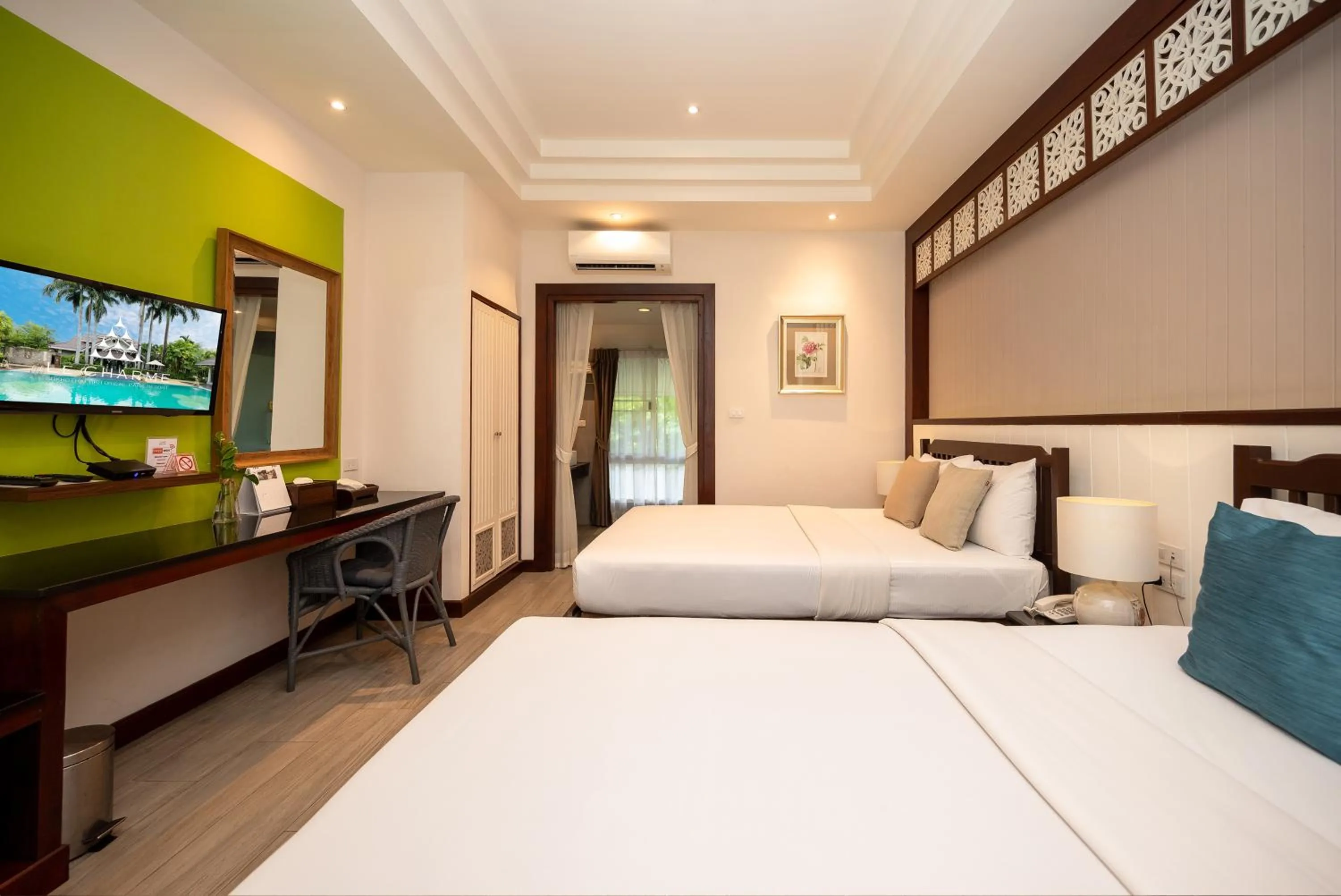 Bed in Le Charme Sukhothai Historical Park