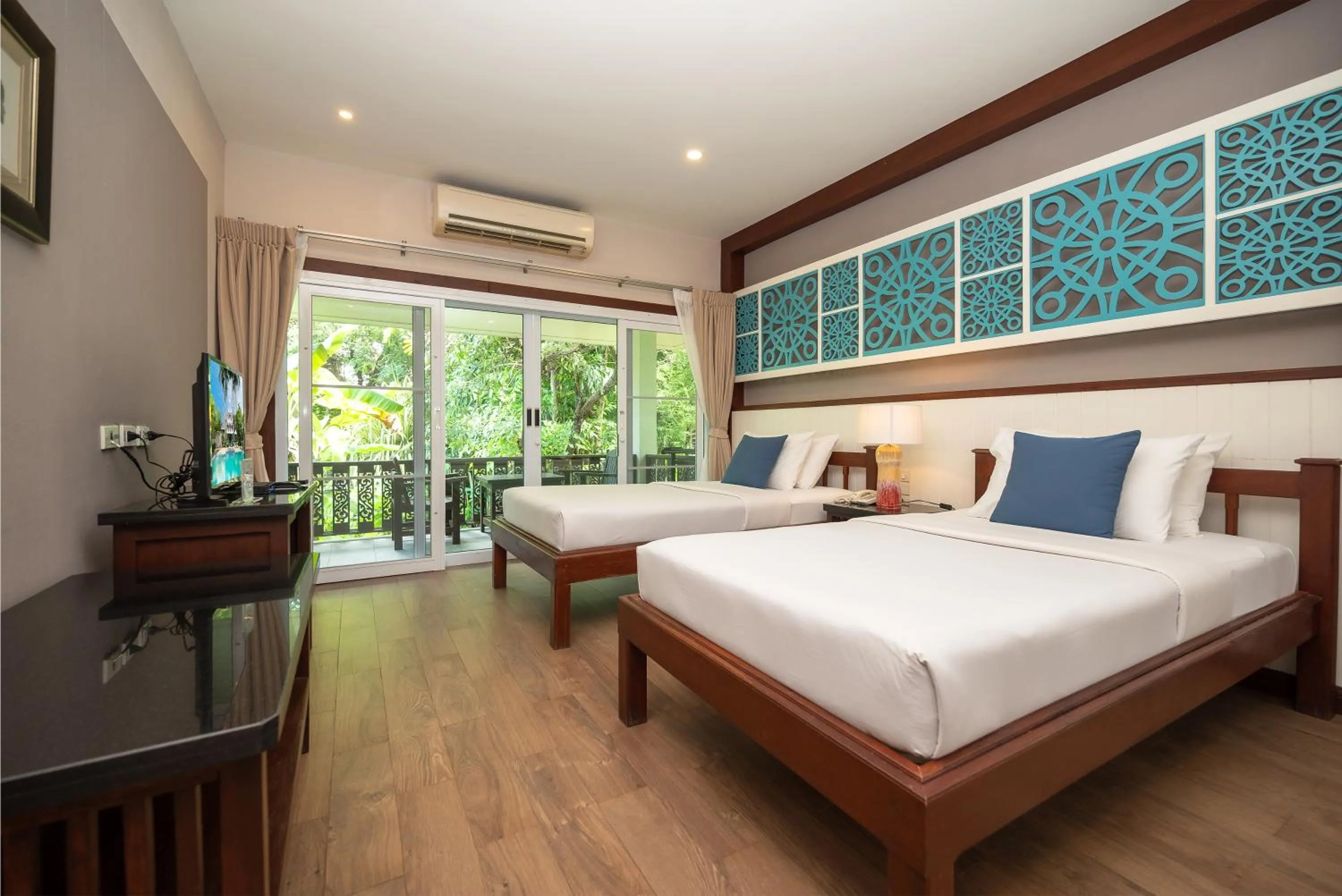 Bed in Le Charme Sukhothai Historical Park