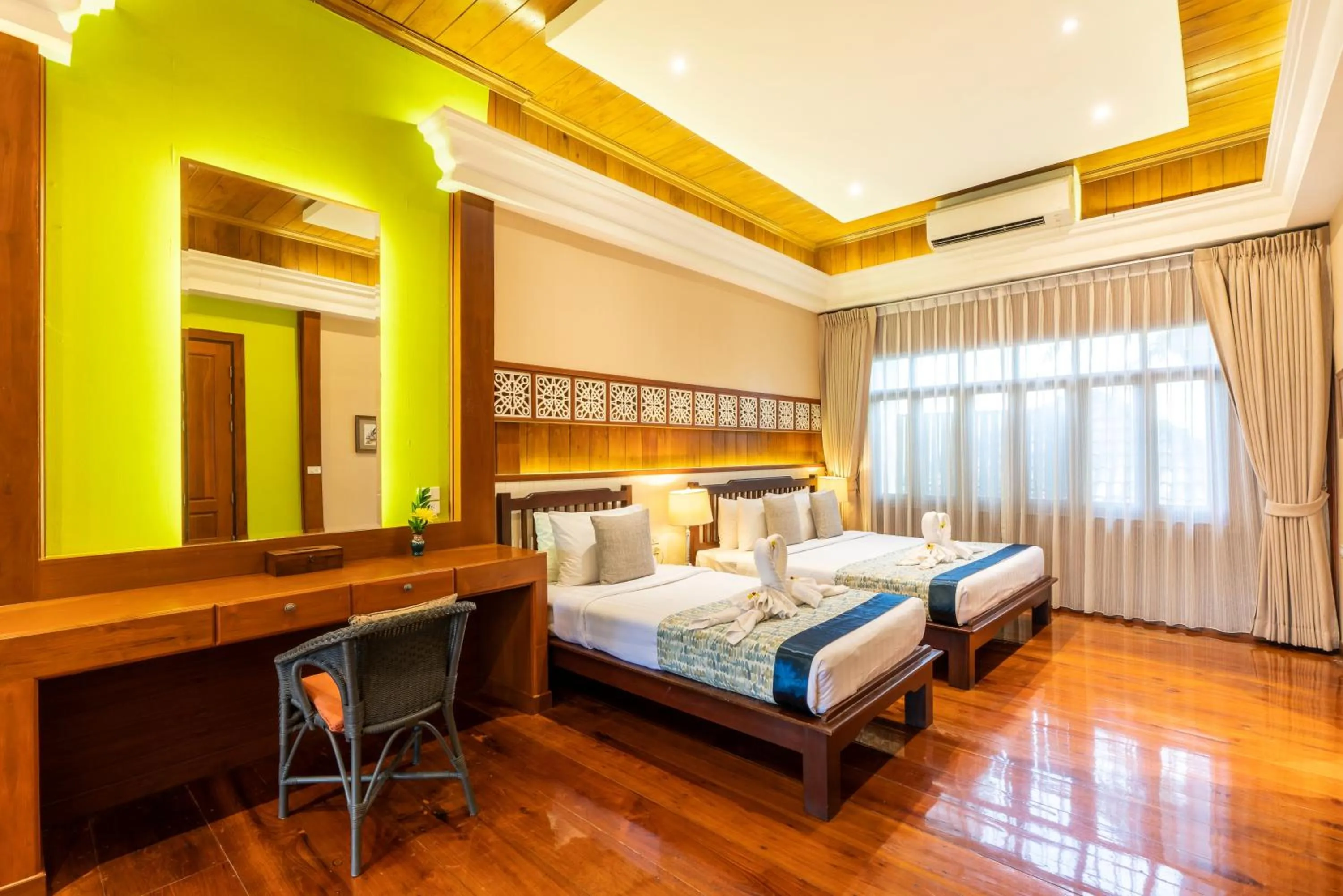 Bed in Le Charme Sukhothai Historical Park