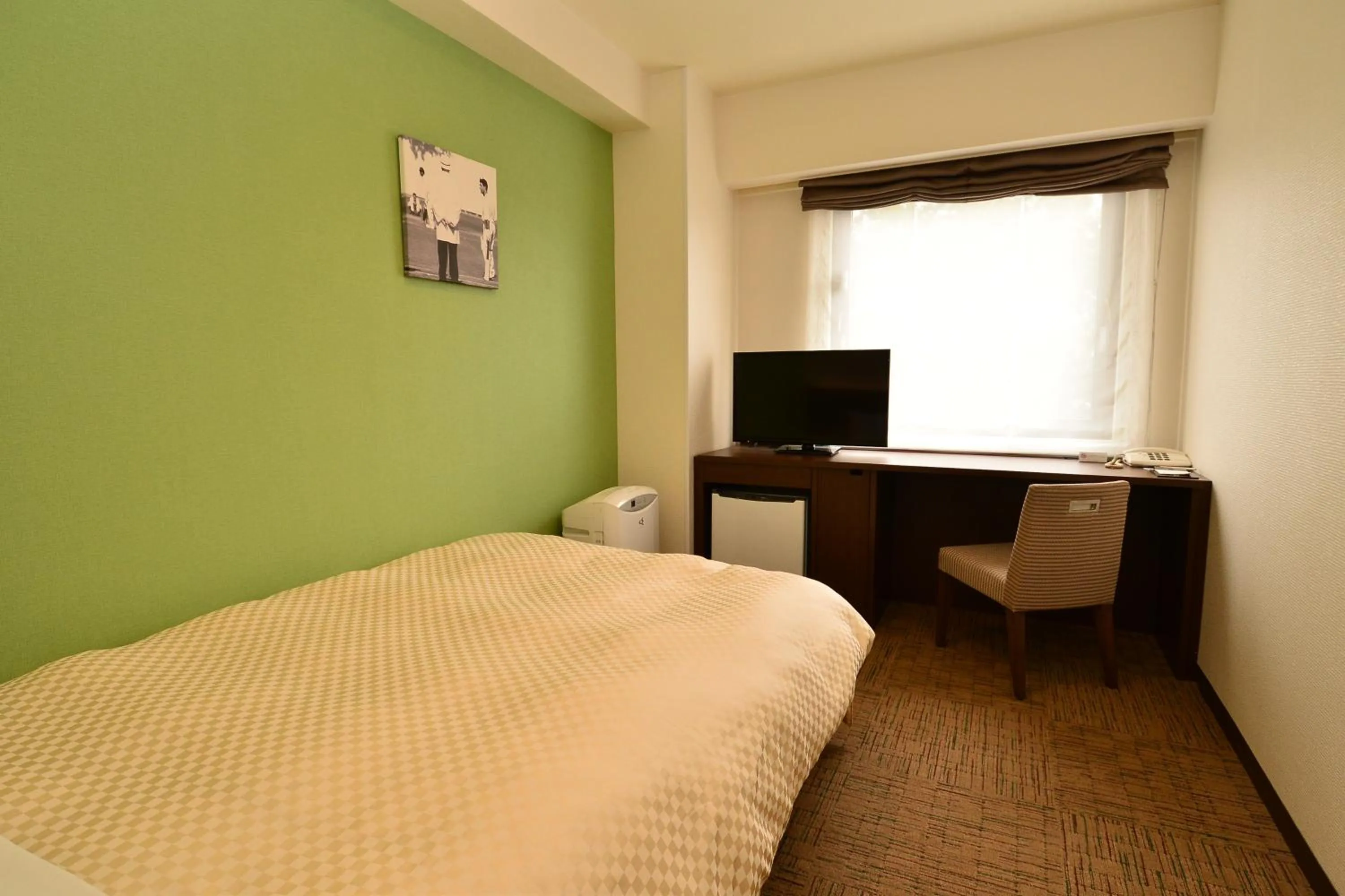 Bed in Hotel Sunroute Sano