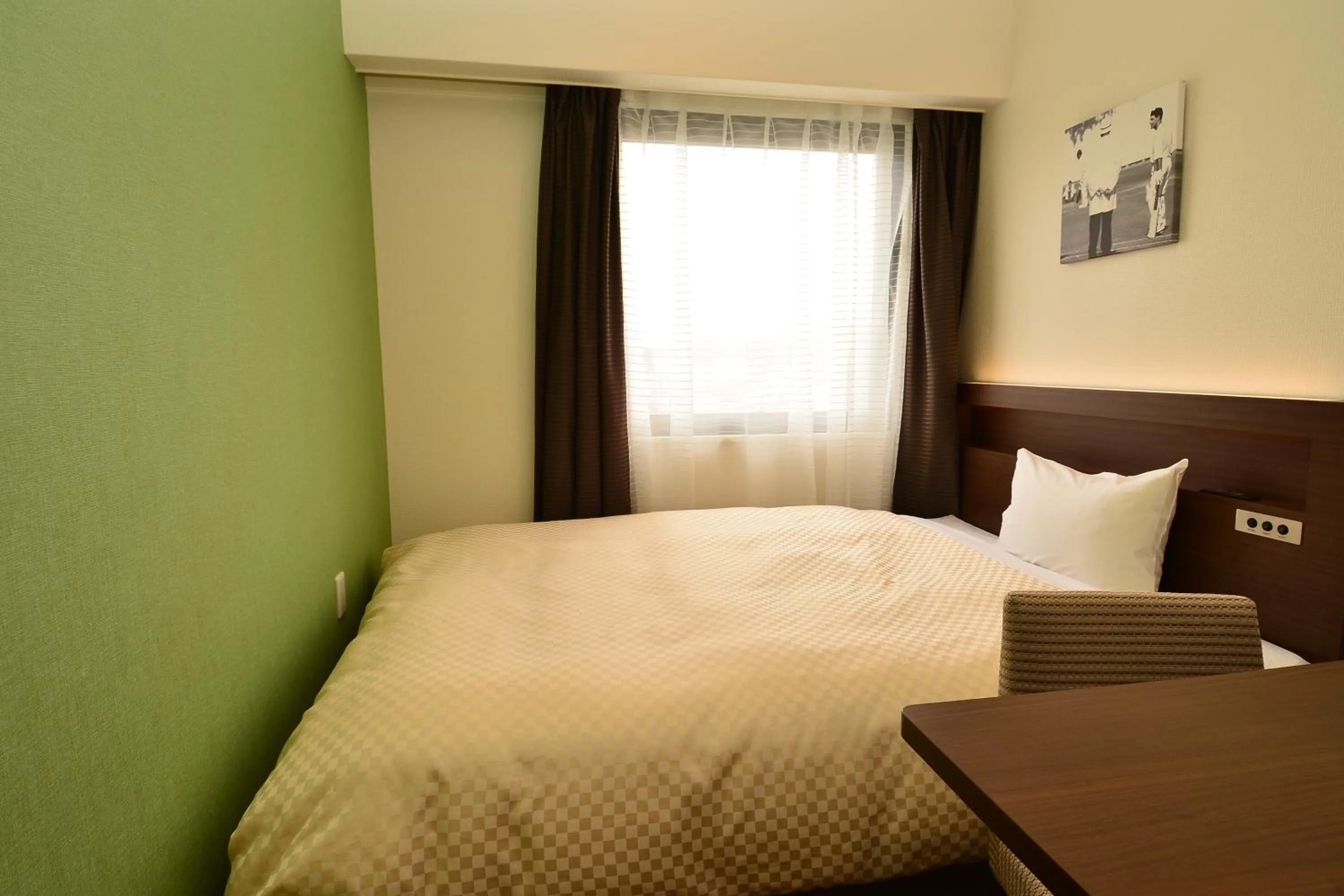 Bed in Hotel Sunroute Sano