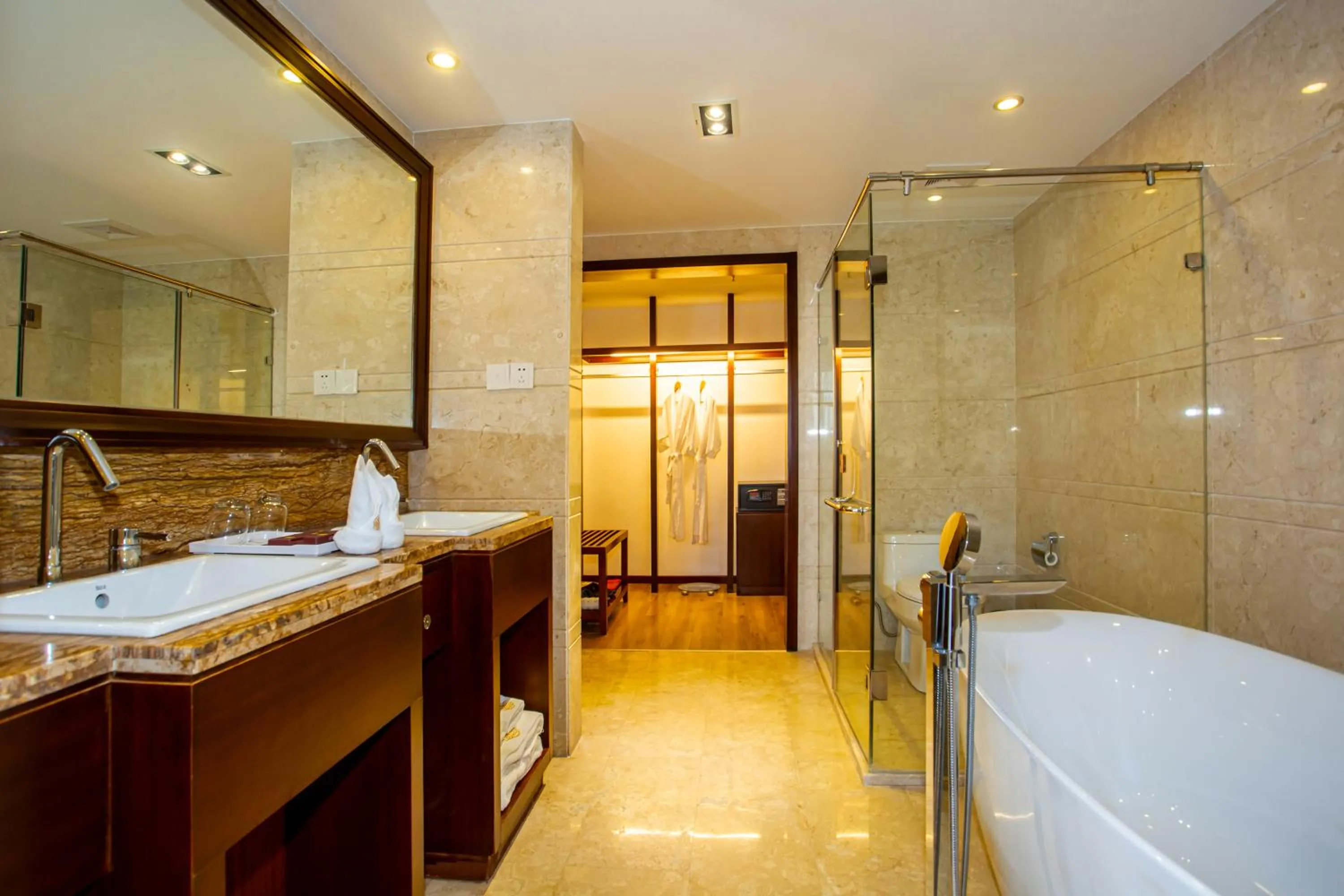 Bathroom in Ramada Encore by Wyndham Qionghai Downtown