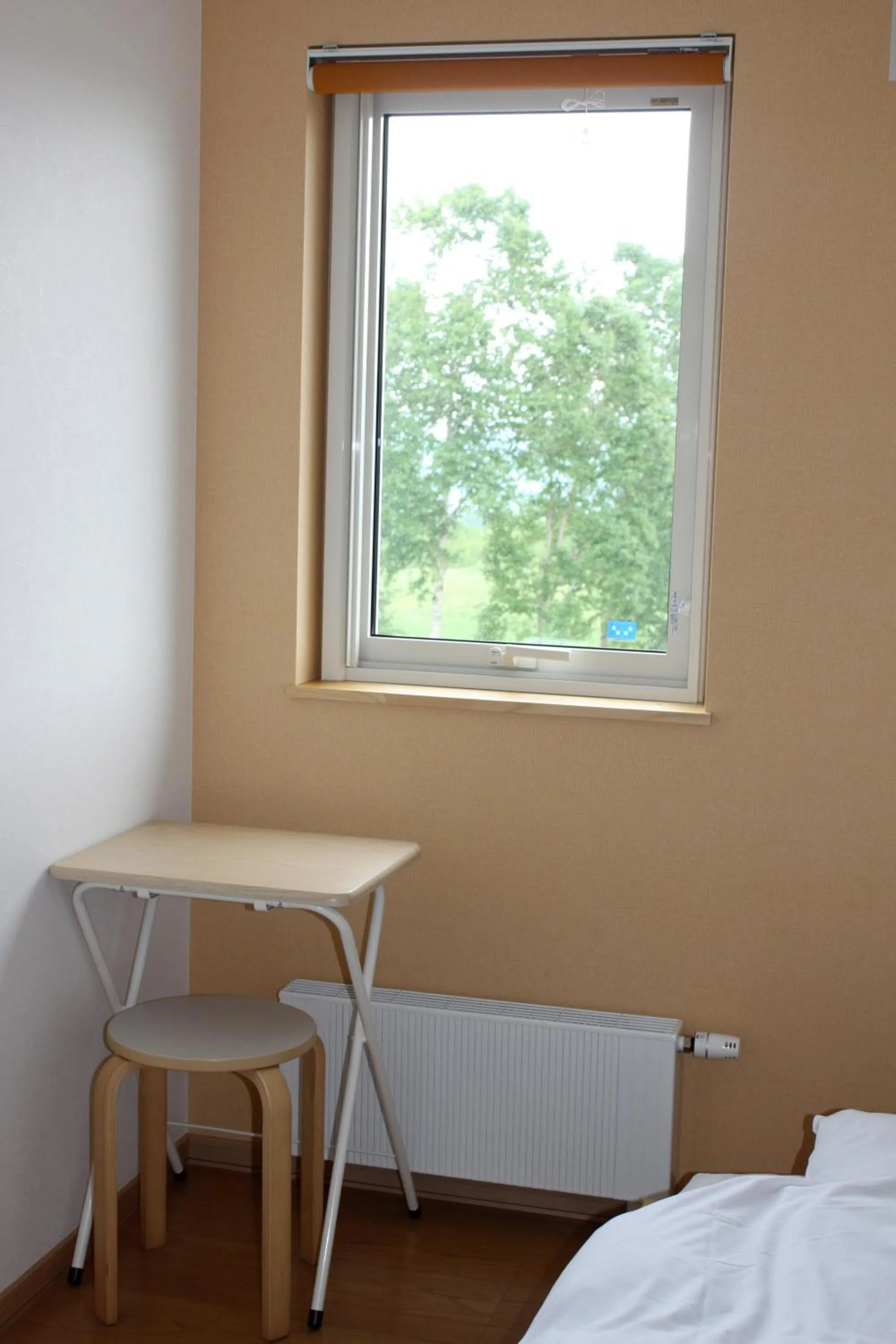 Bed in Niseko Guesthouse Nalu.